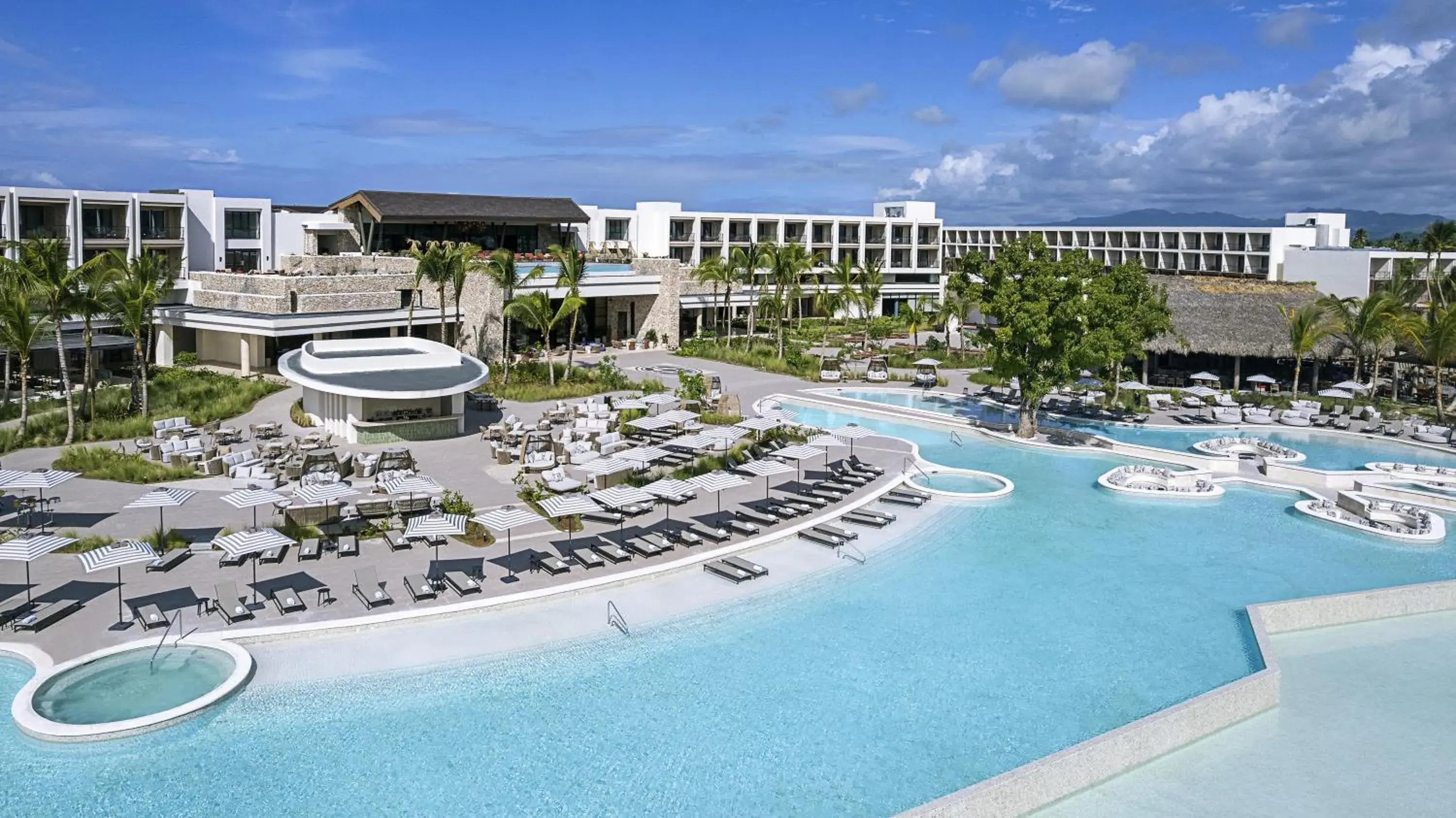 Pool view in Zemi Miches Punta Cana All-Inclusive Resort, Curio by Hilton Pool view in Zemi Miches Punta Cana All-Inclusive Resort, Curio by Hilton