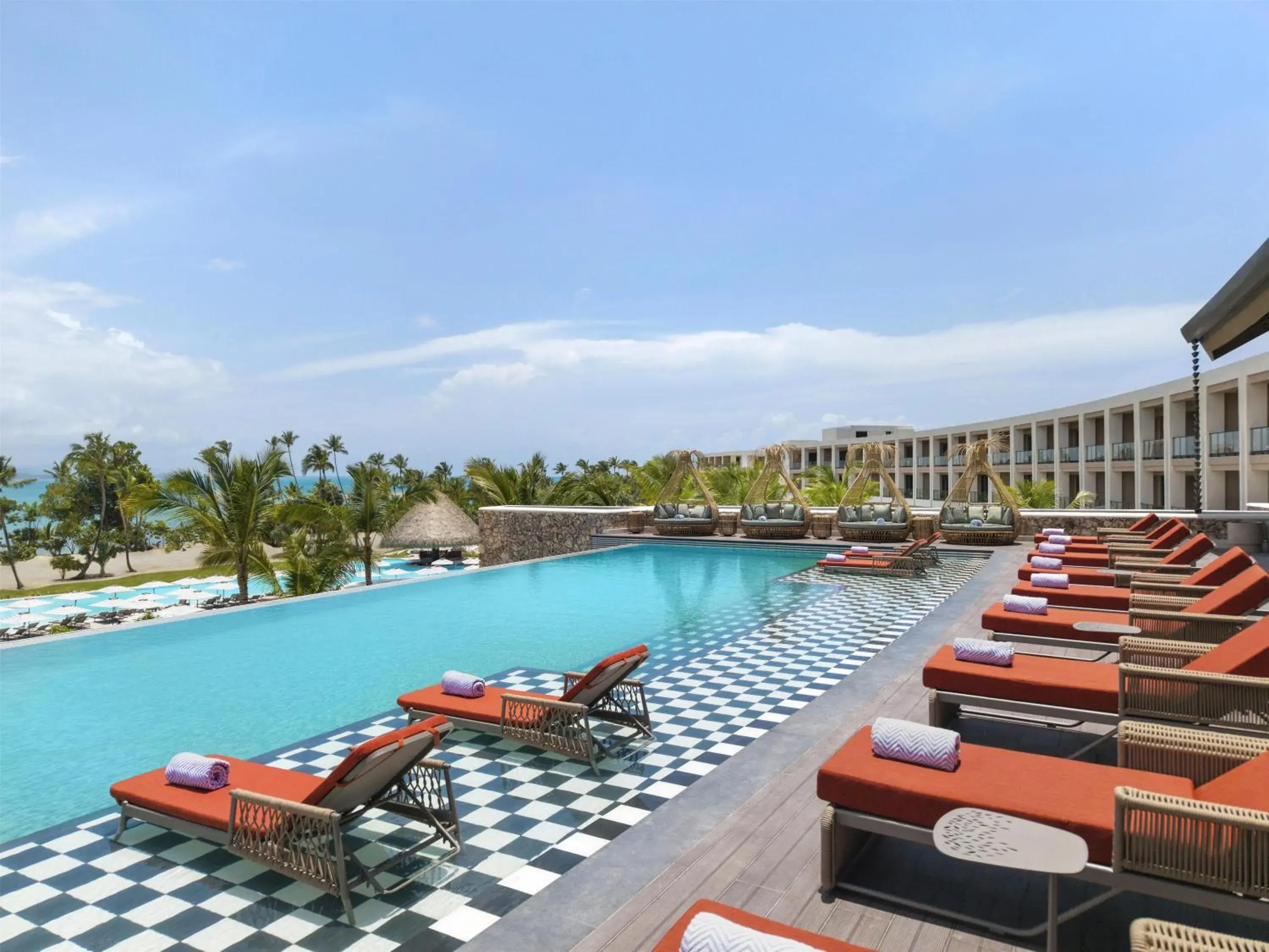 Pool view in Zemi Miches Punta Cana All-Inclusive Resort, Curio by Hilton Pool view in Zemi Miches Punta Cana All-Inclusive Resort, Curio by Hilton