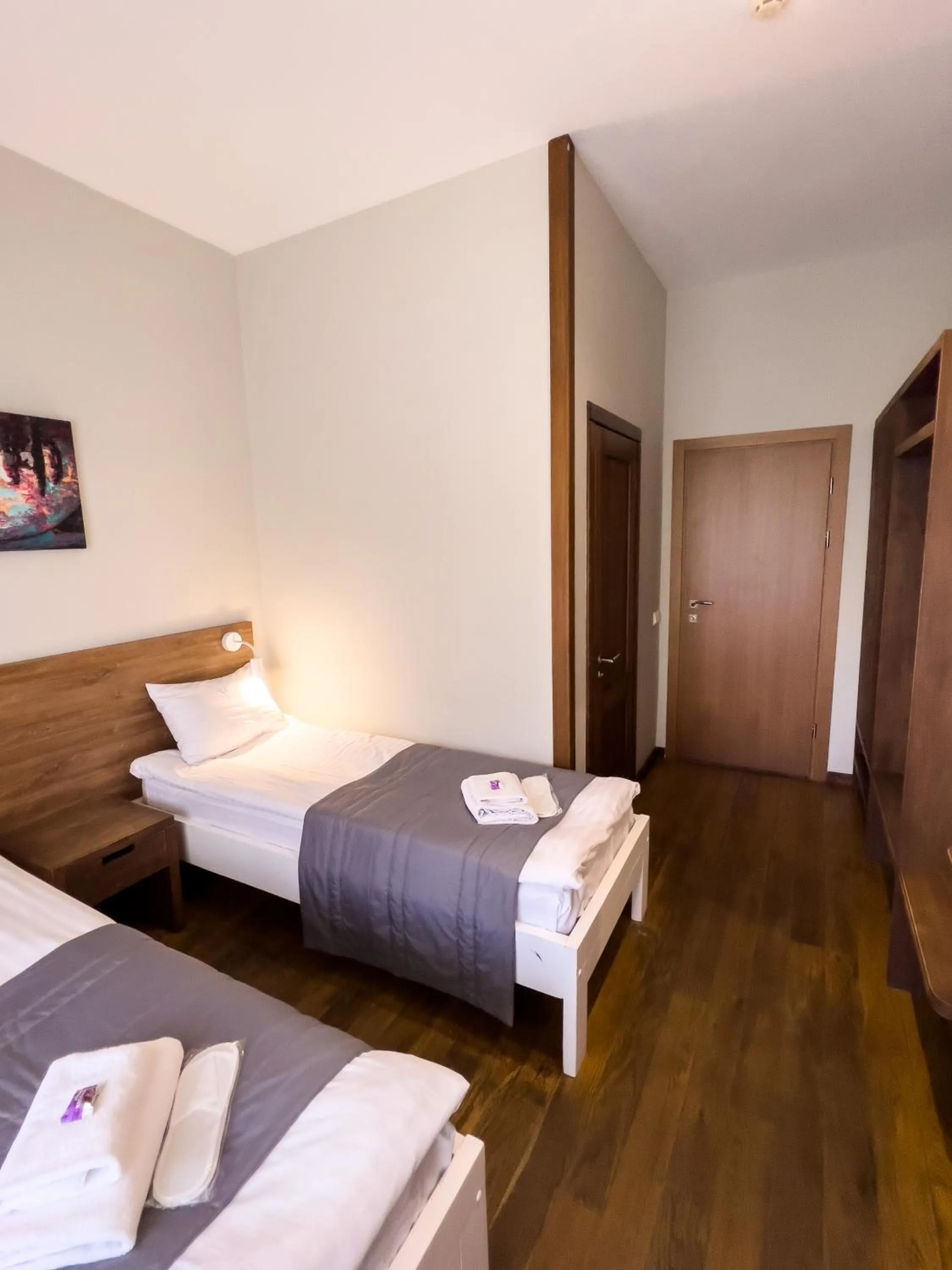 Bed in NeboS Hotel & Restaurant