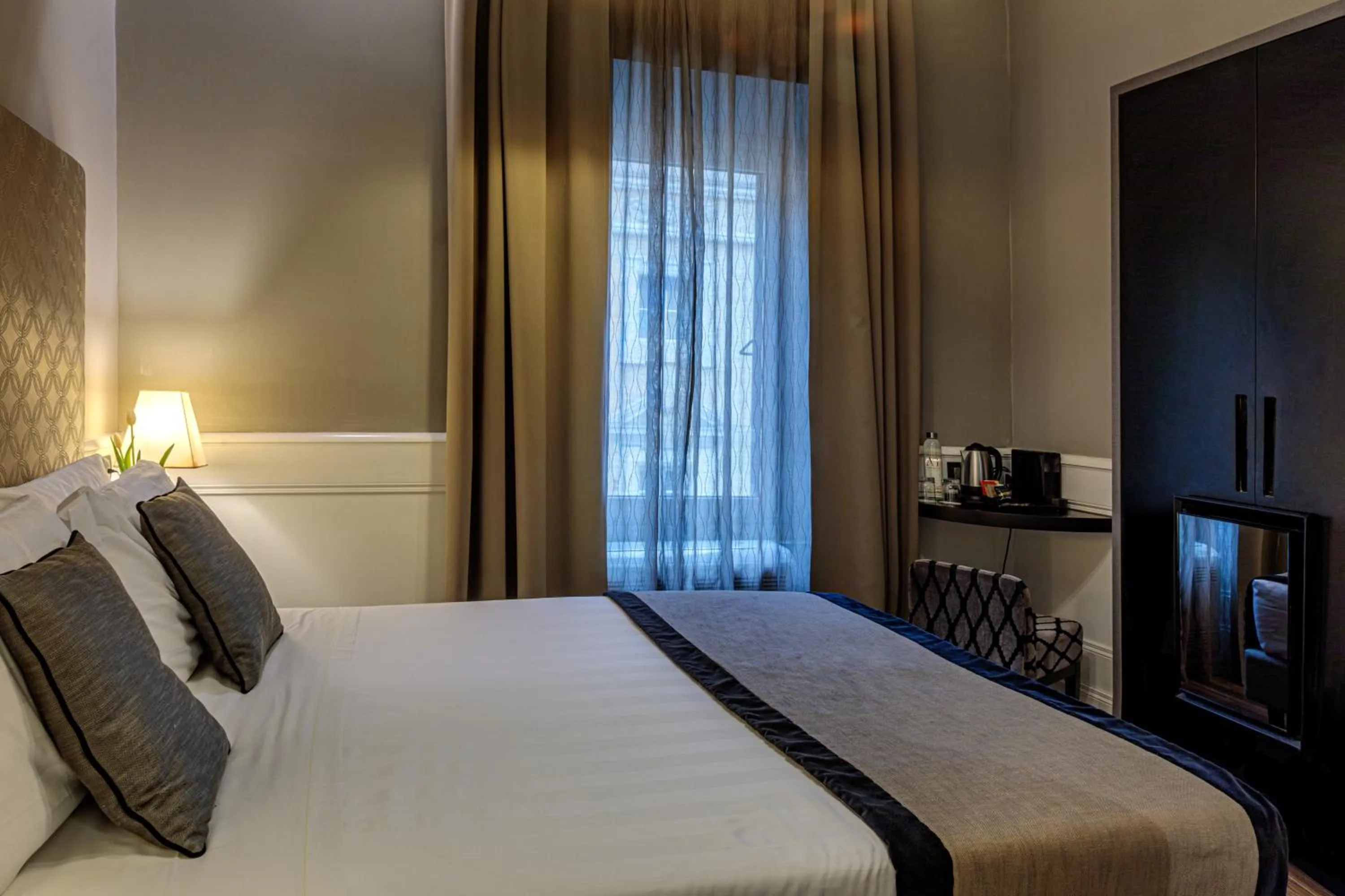 Bed in The Independent Suites