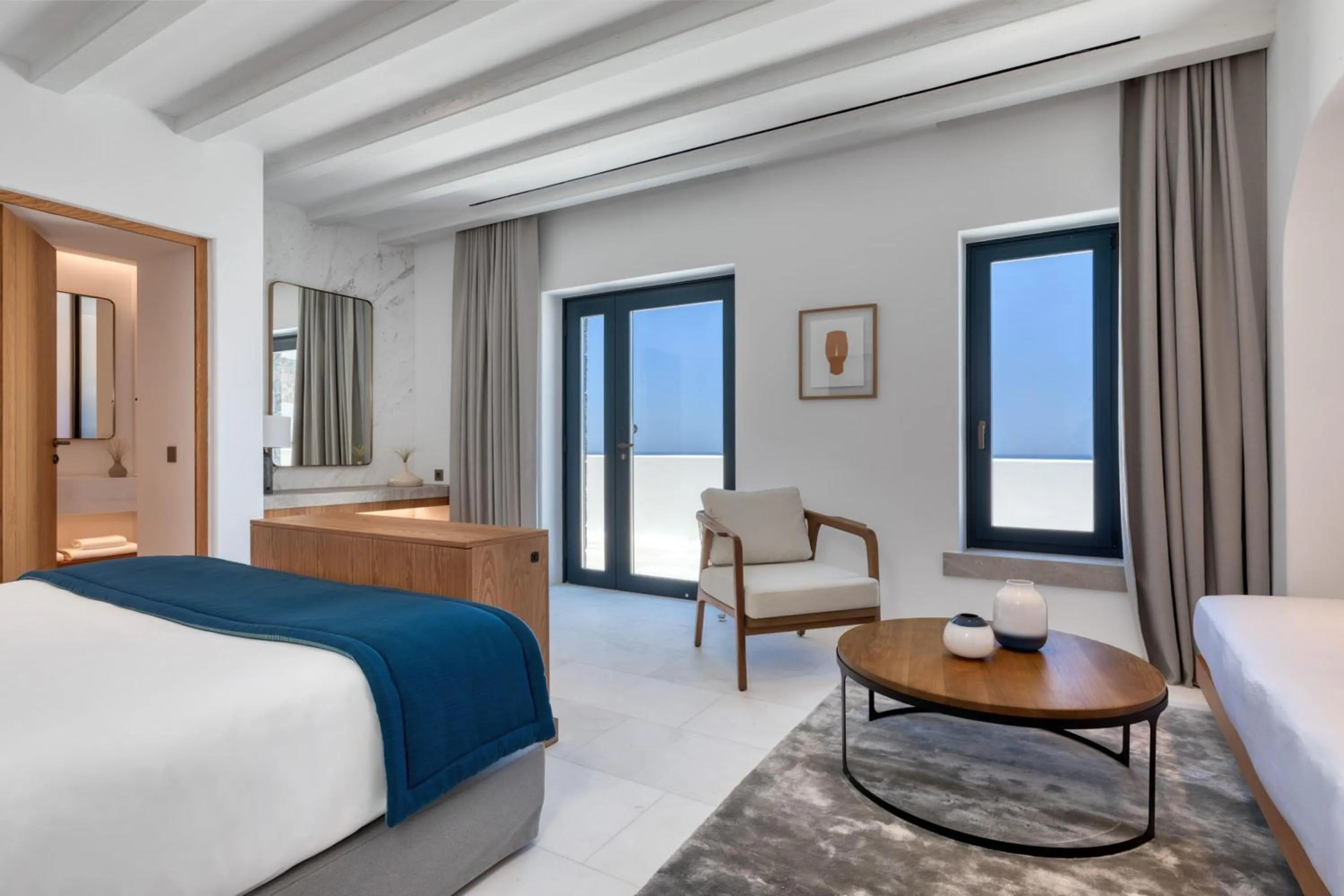 Living room, Bed in Sandblu Santorini, LXR Hotels & Resorts