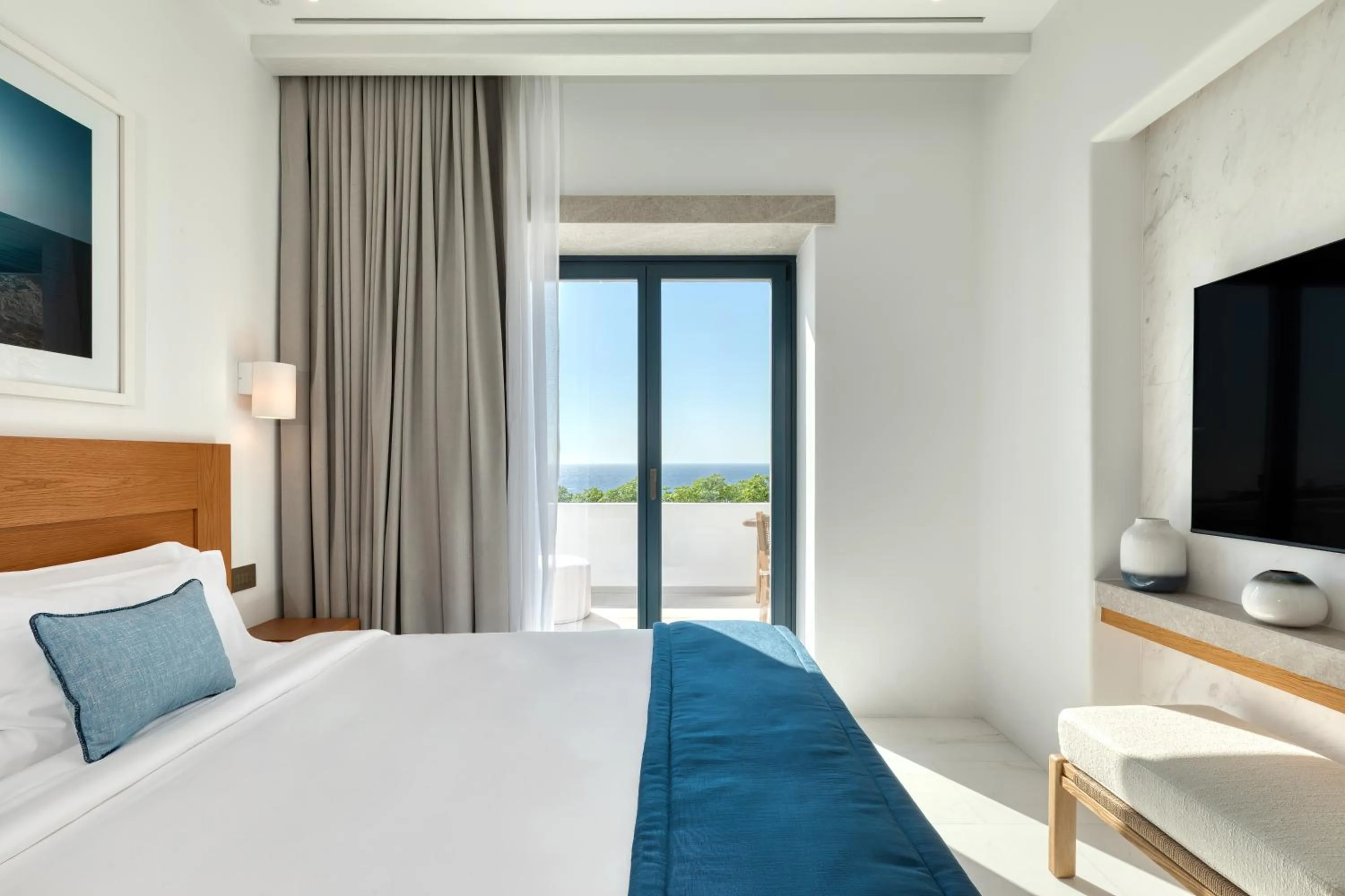 Bed in Sandblu Santorini, LXR Hotels & Resorts