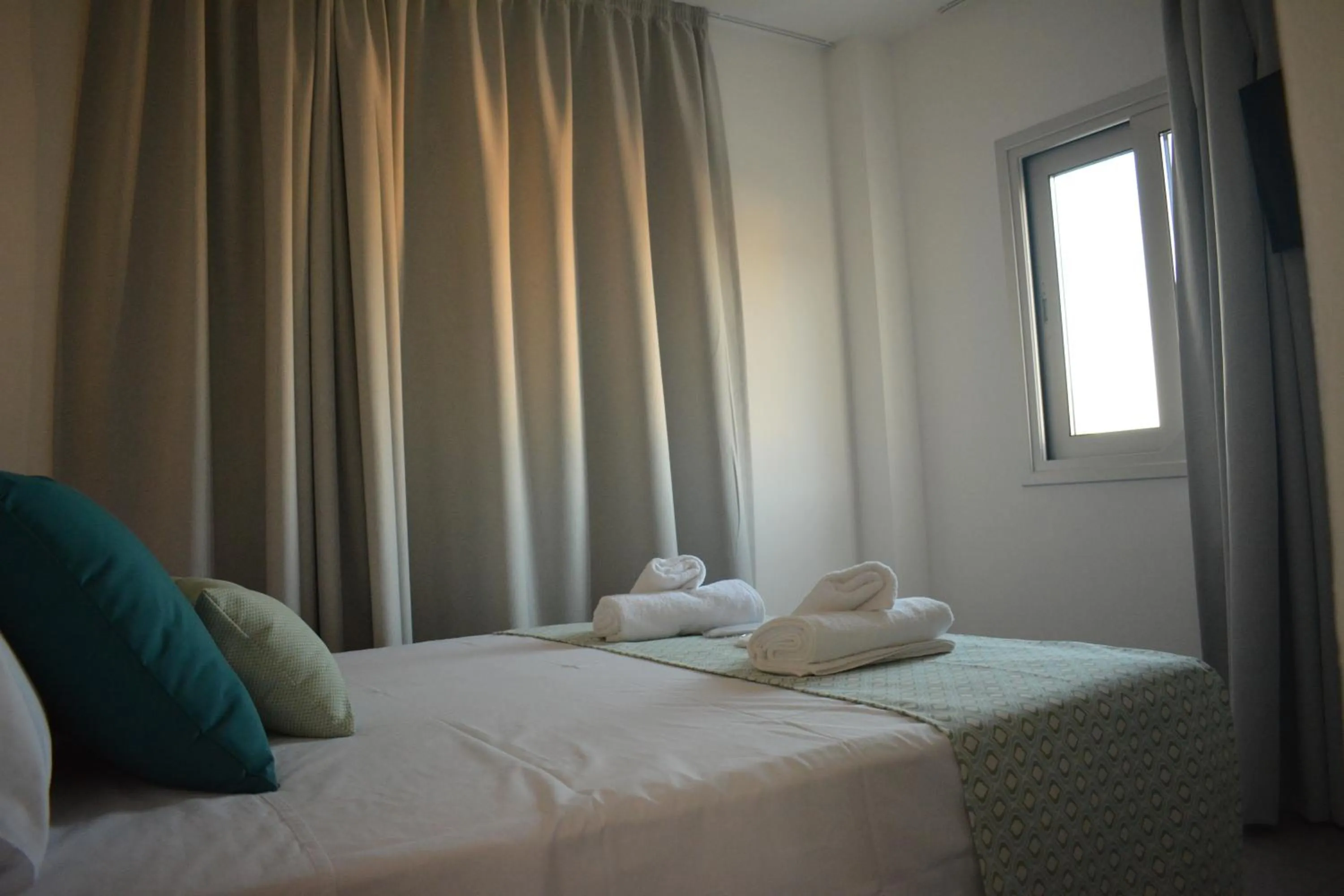 Bed in Green Bay Suites