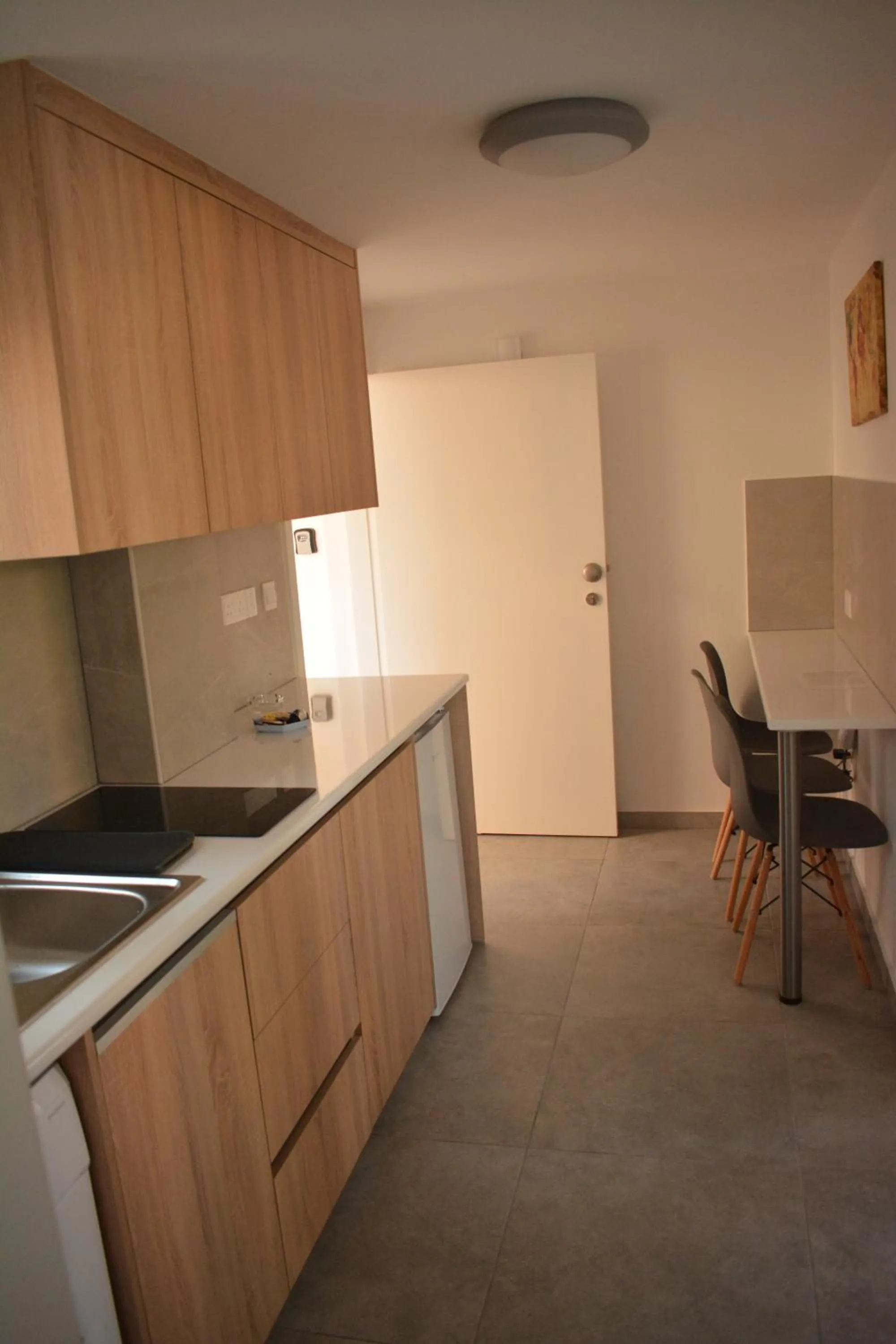 Kitchen or kitchenette in Green Bay Suites