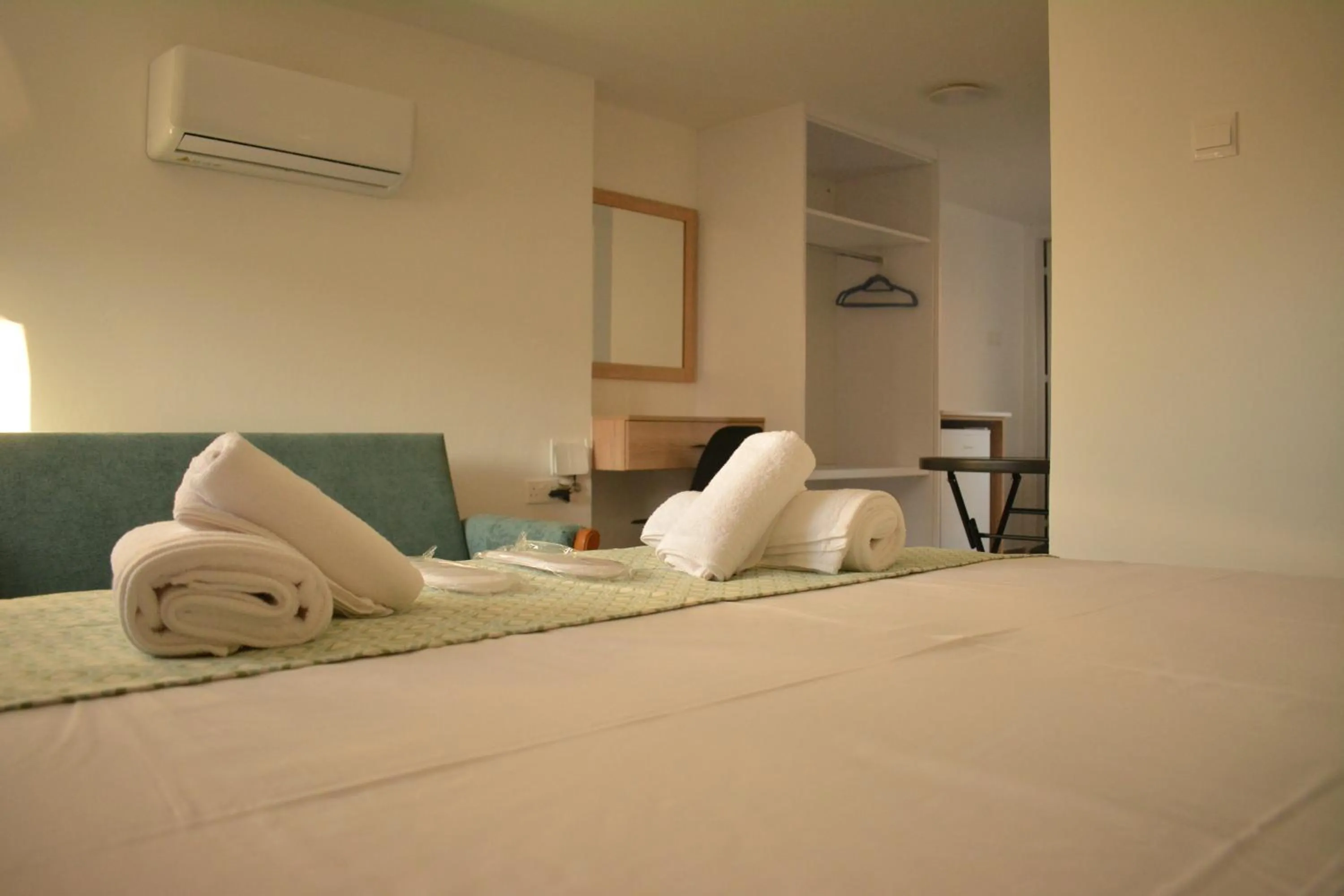 Bed in Green Bay Suites