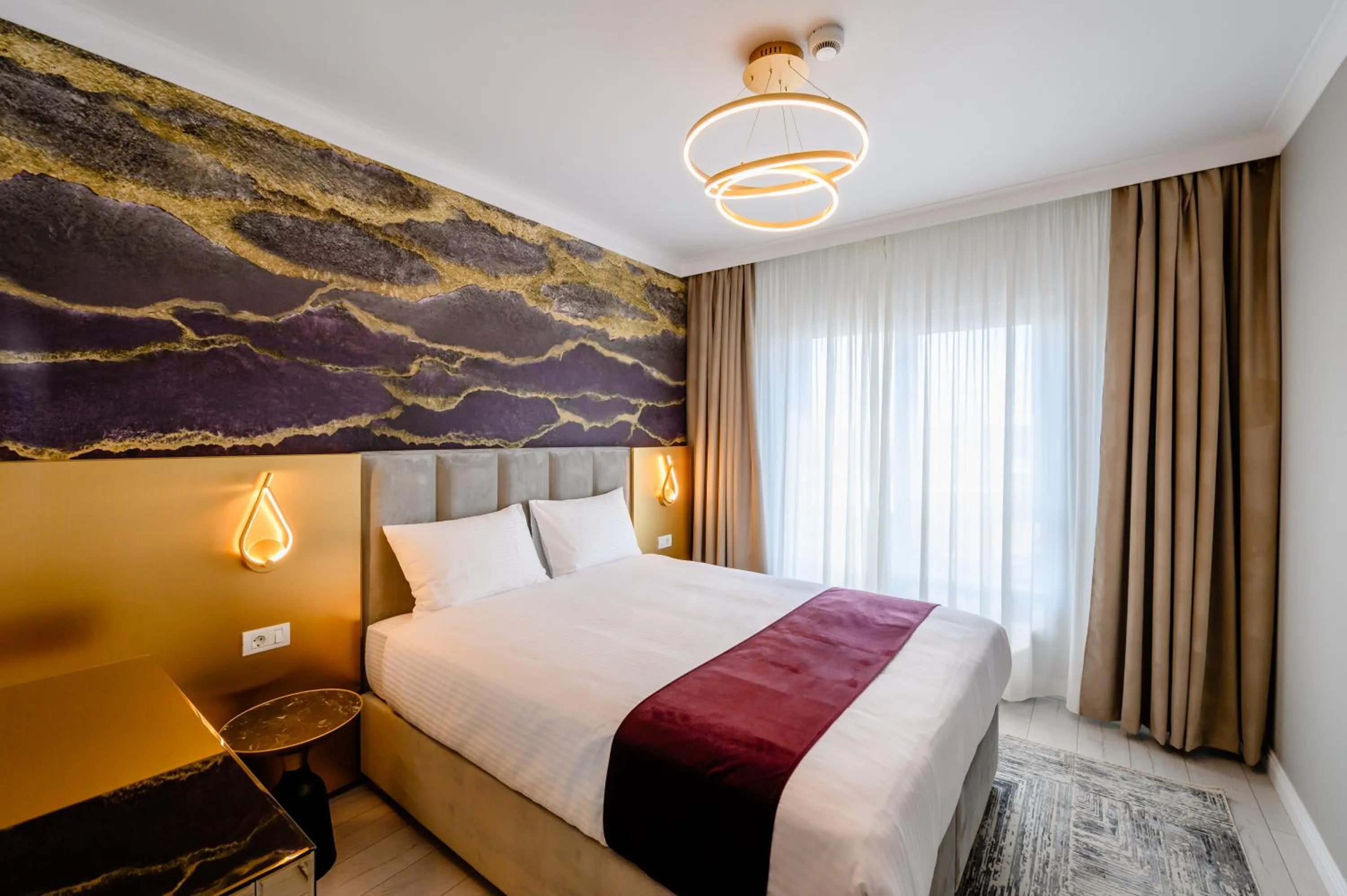 Bed in Elitte Inn & Suites