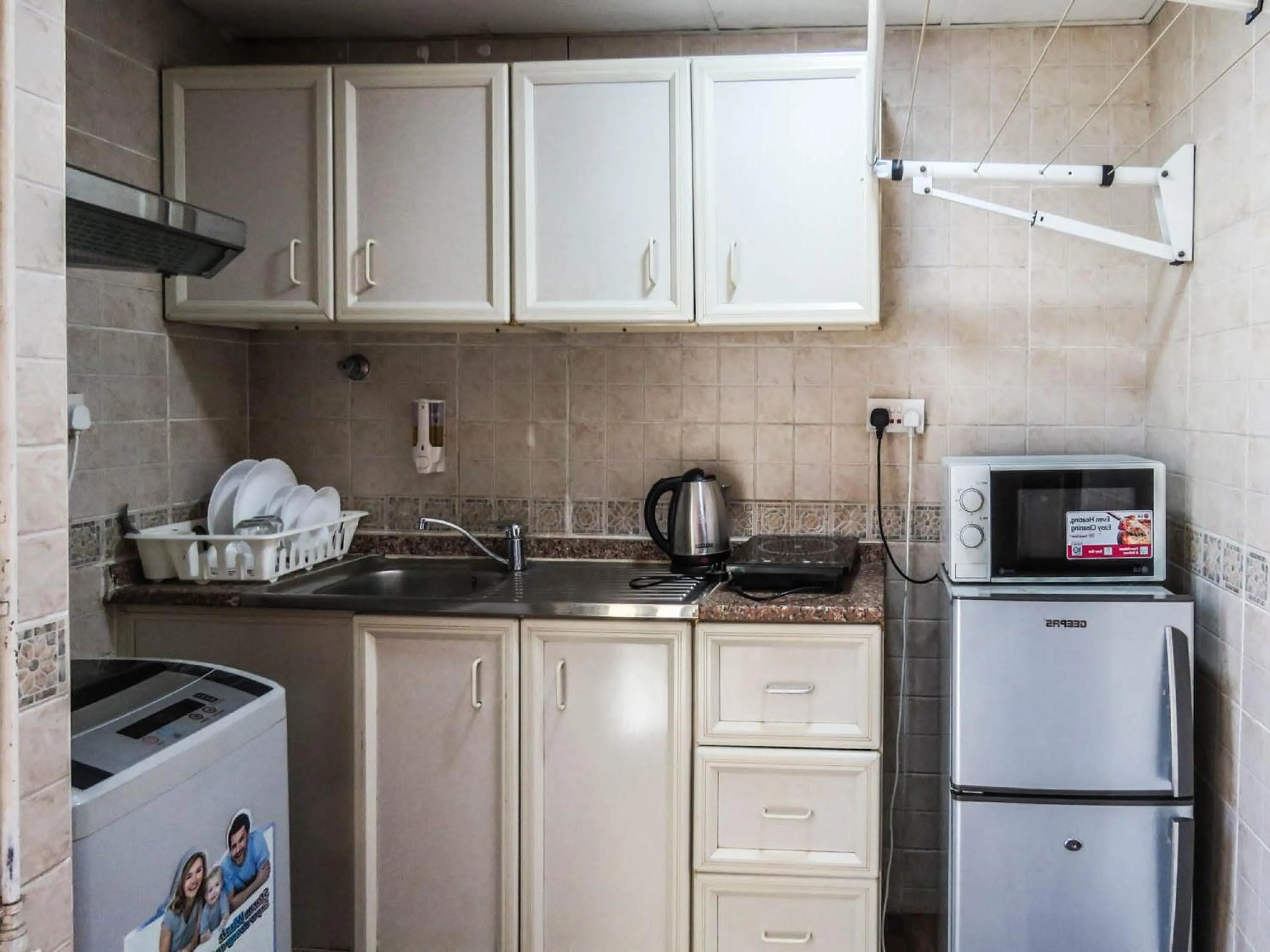 Kitchen or kitchenette in Al Ferdous Hotel Apartment