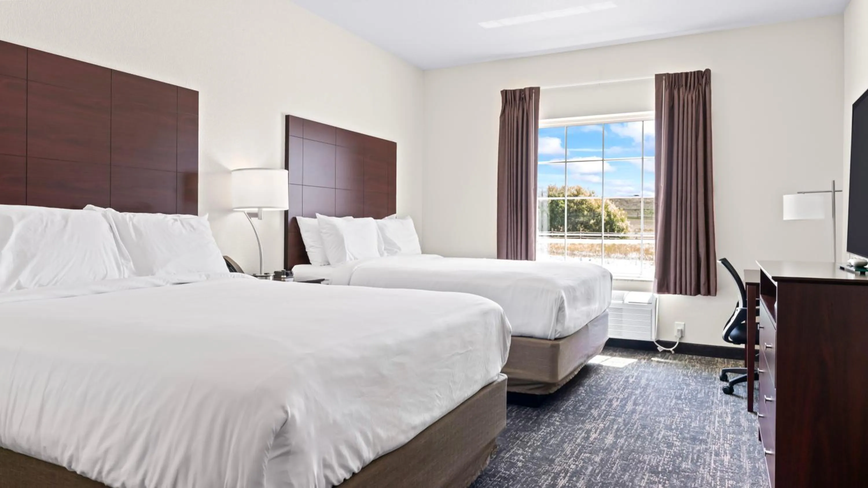 Bed in Cobblestone Inn & Suites - Julesburg