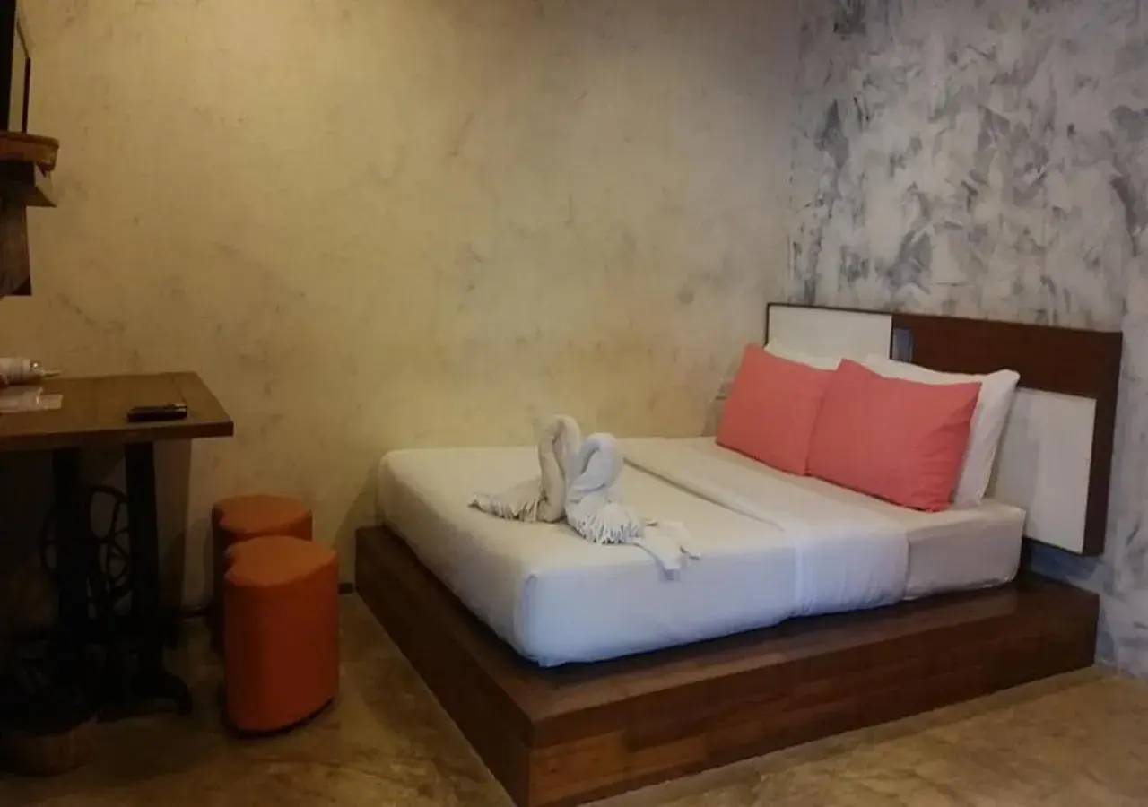 Bed in BaanChompooAmphawa Bed in BaanChompooAmphawa