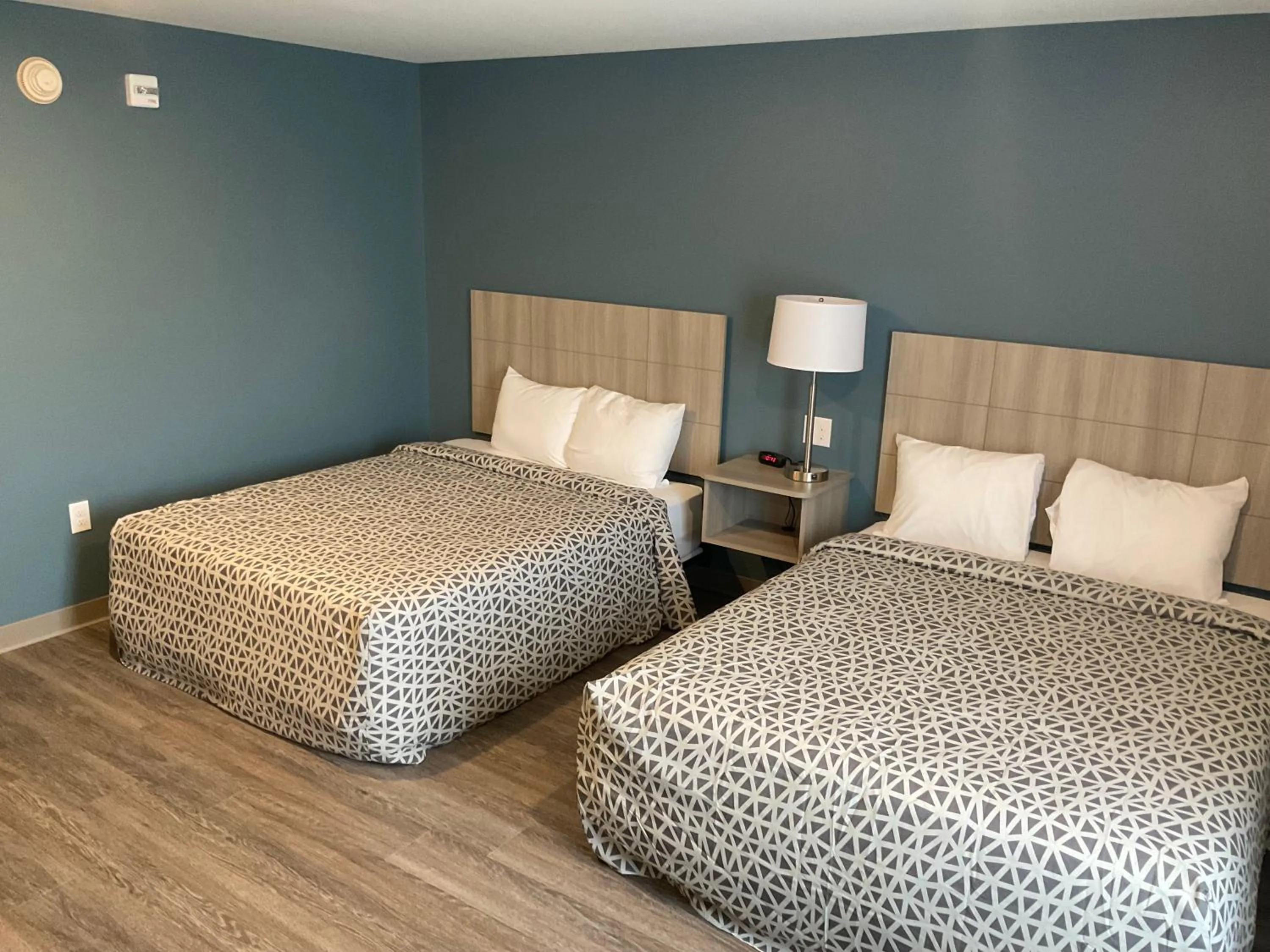 Bedroom, Bed in WoodSpring Suites Winston-Salem near Hanes Mall