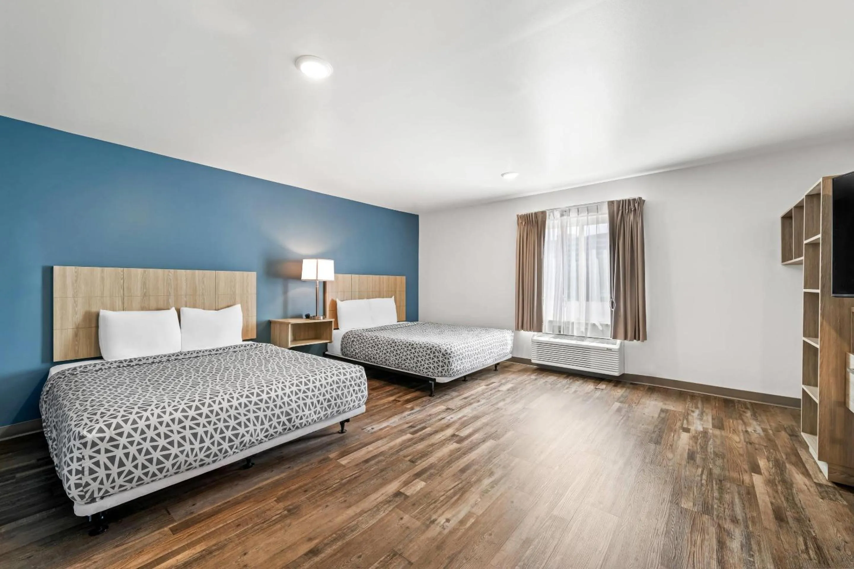 Bedroom, Bed in WoodSpring Suites Winston-Salem near Hanes Mall