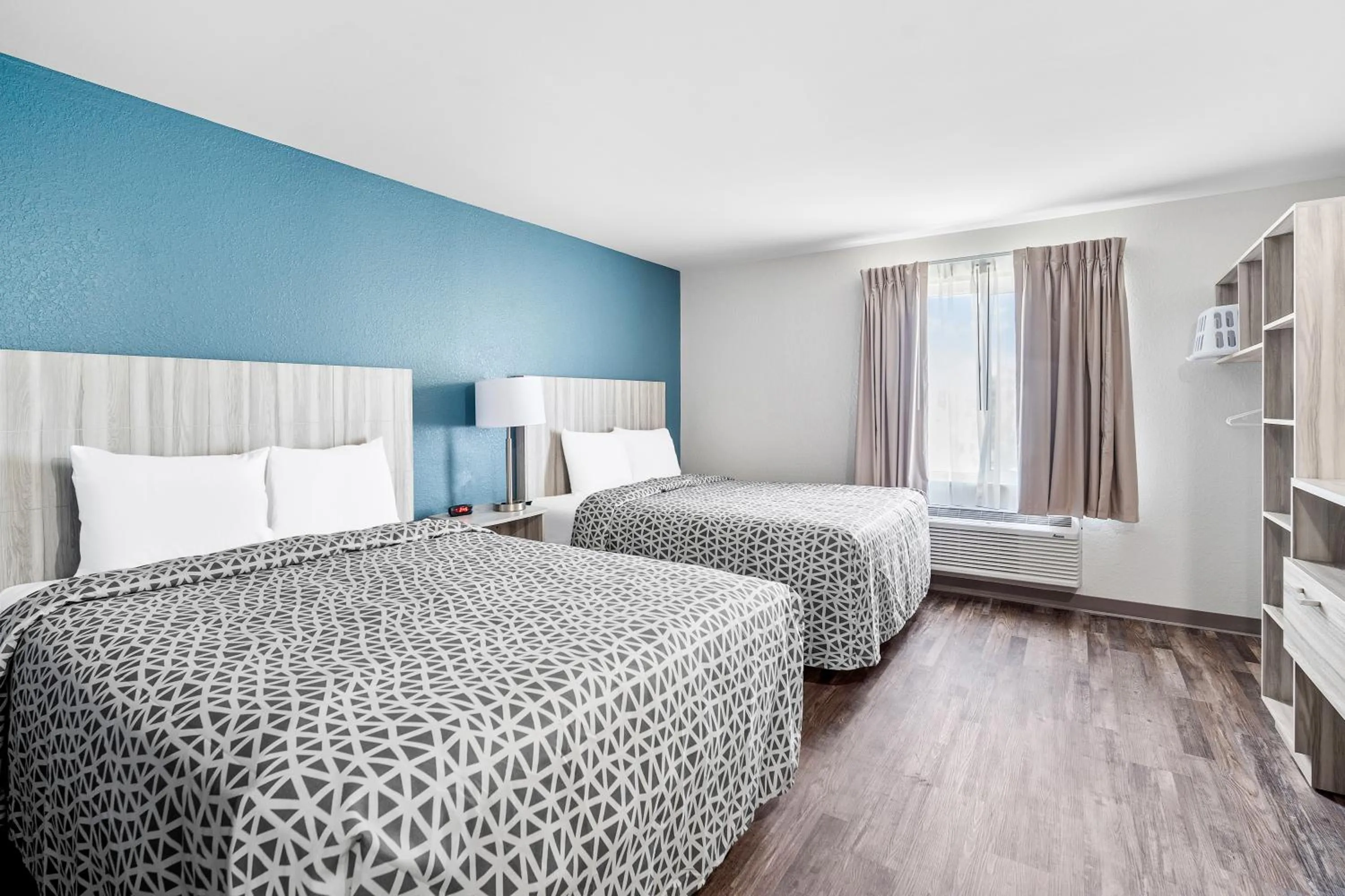 Bedroom, Bed in WoodSpring Suites Winston-Salem near Hanes Mall