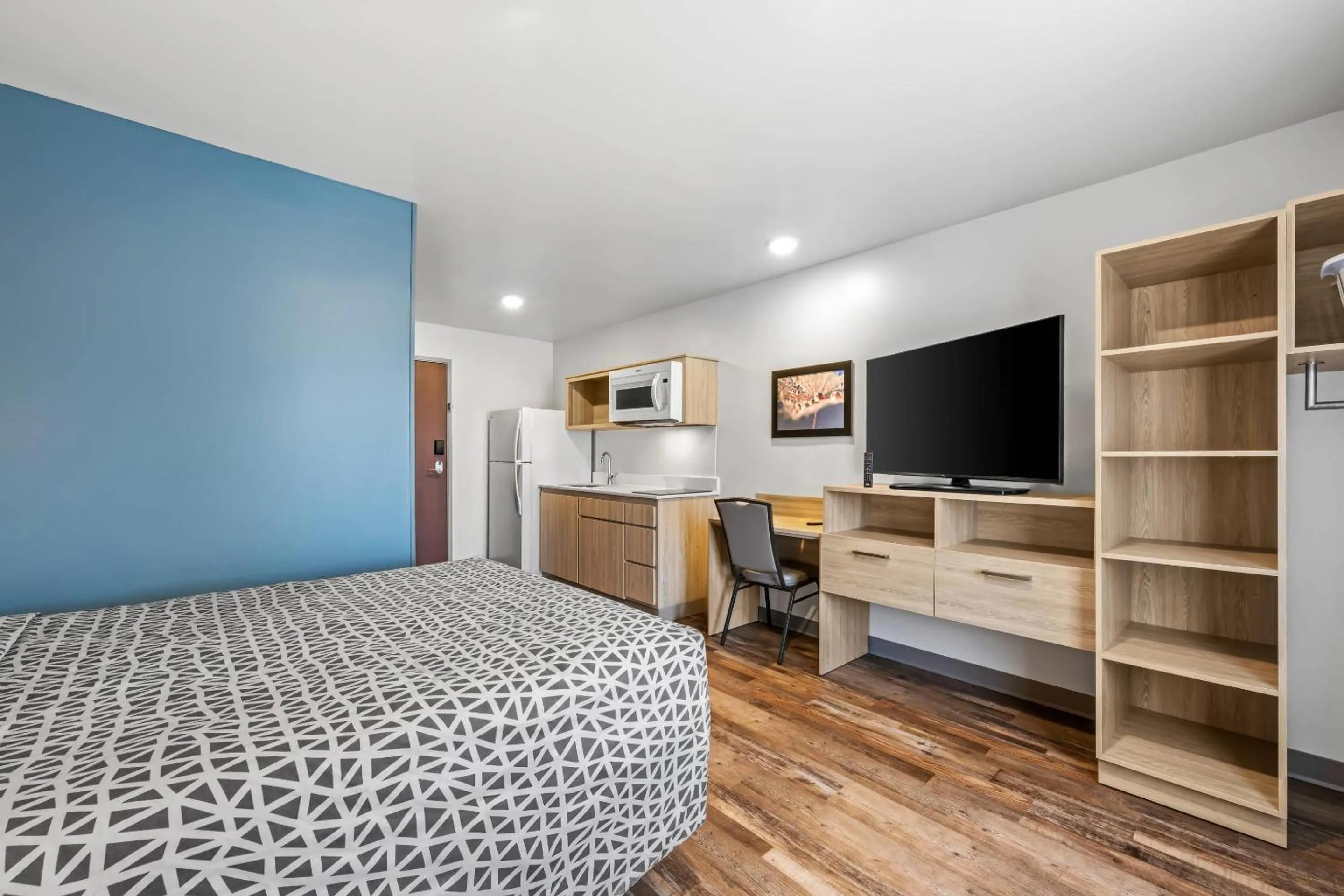 Bedroom, Bed in WoodSpring Suites Winston-Salem near Hanes Mall