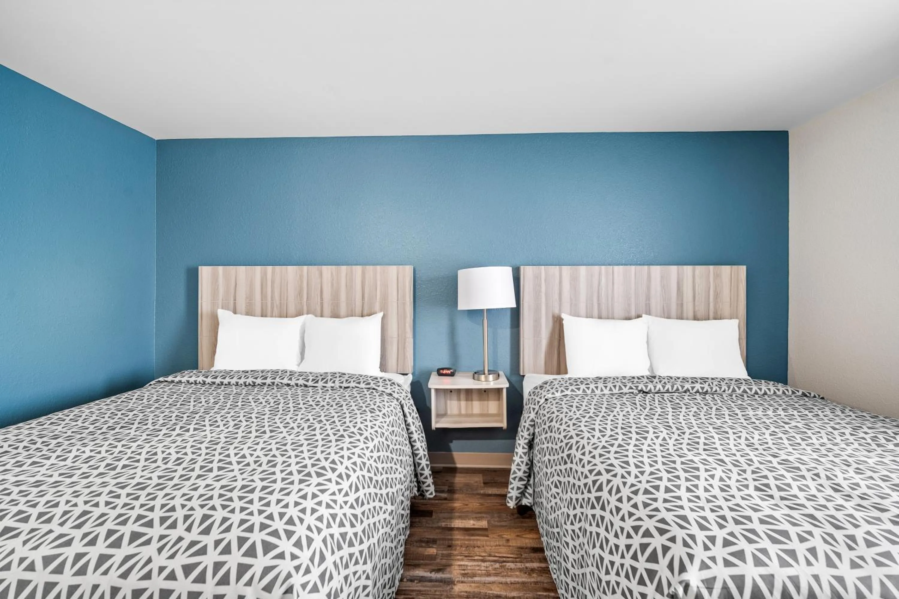 Bedroom, Bed in WoodSpring Suites Winston-Salem near Hanes Mall