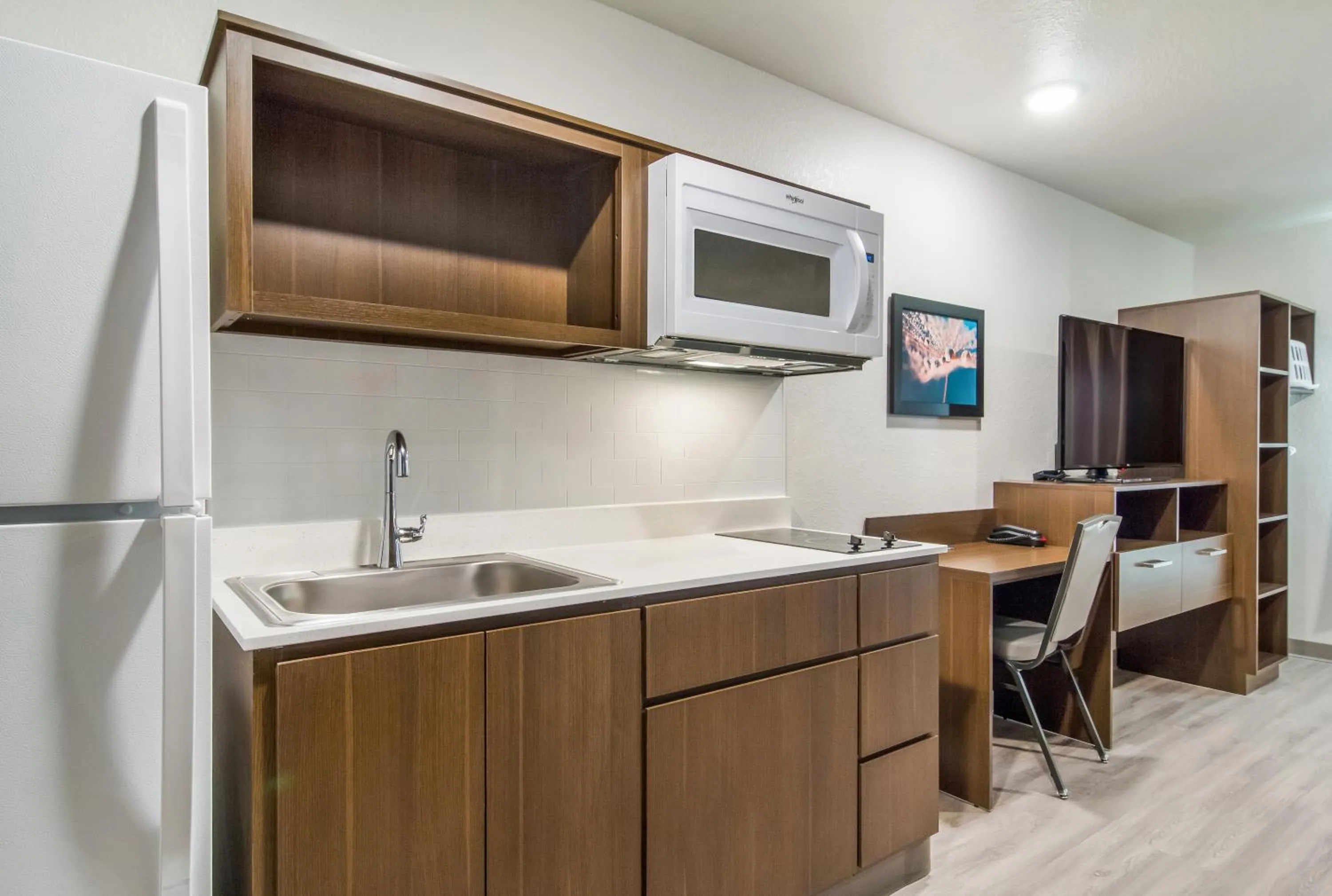 Kitchen or kitchenette in WoodSpring Suites Winston-Salem near Hanes Mall