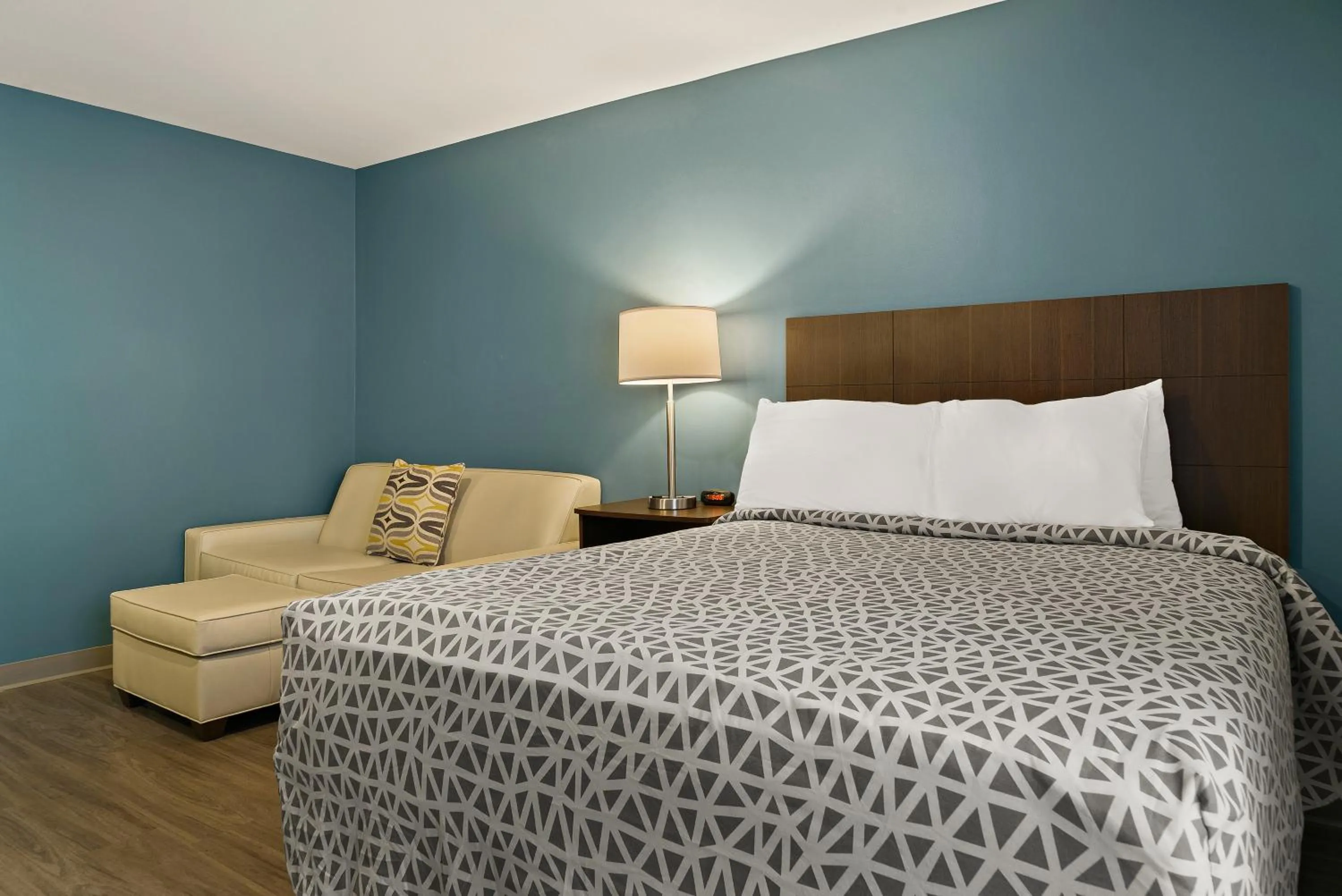 Bed in WoodSpring Suites Winston-Salem near Hanes Mall