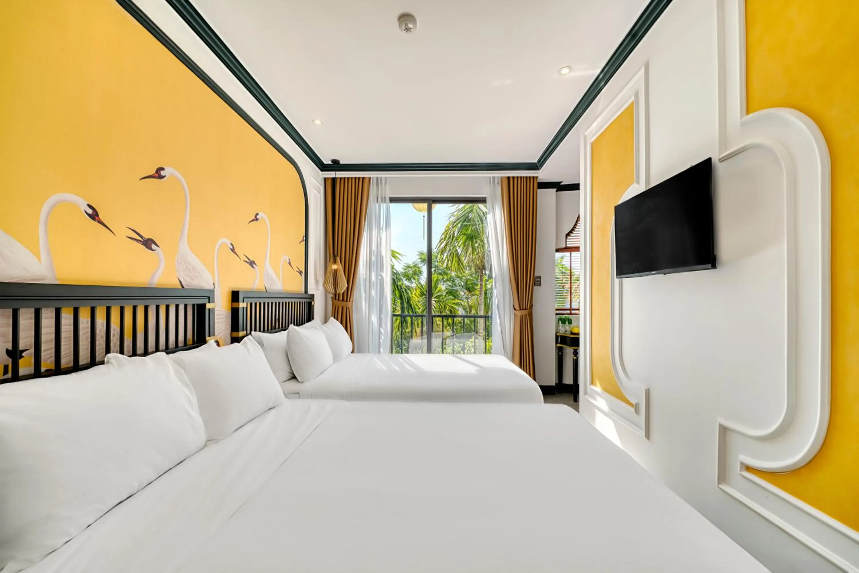 Bed in Rokas Hoi An Boutique Hotel