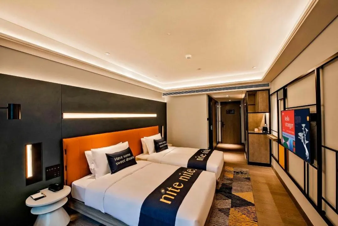 Bed in MUSTEL Hotel Guangzhou Nansha