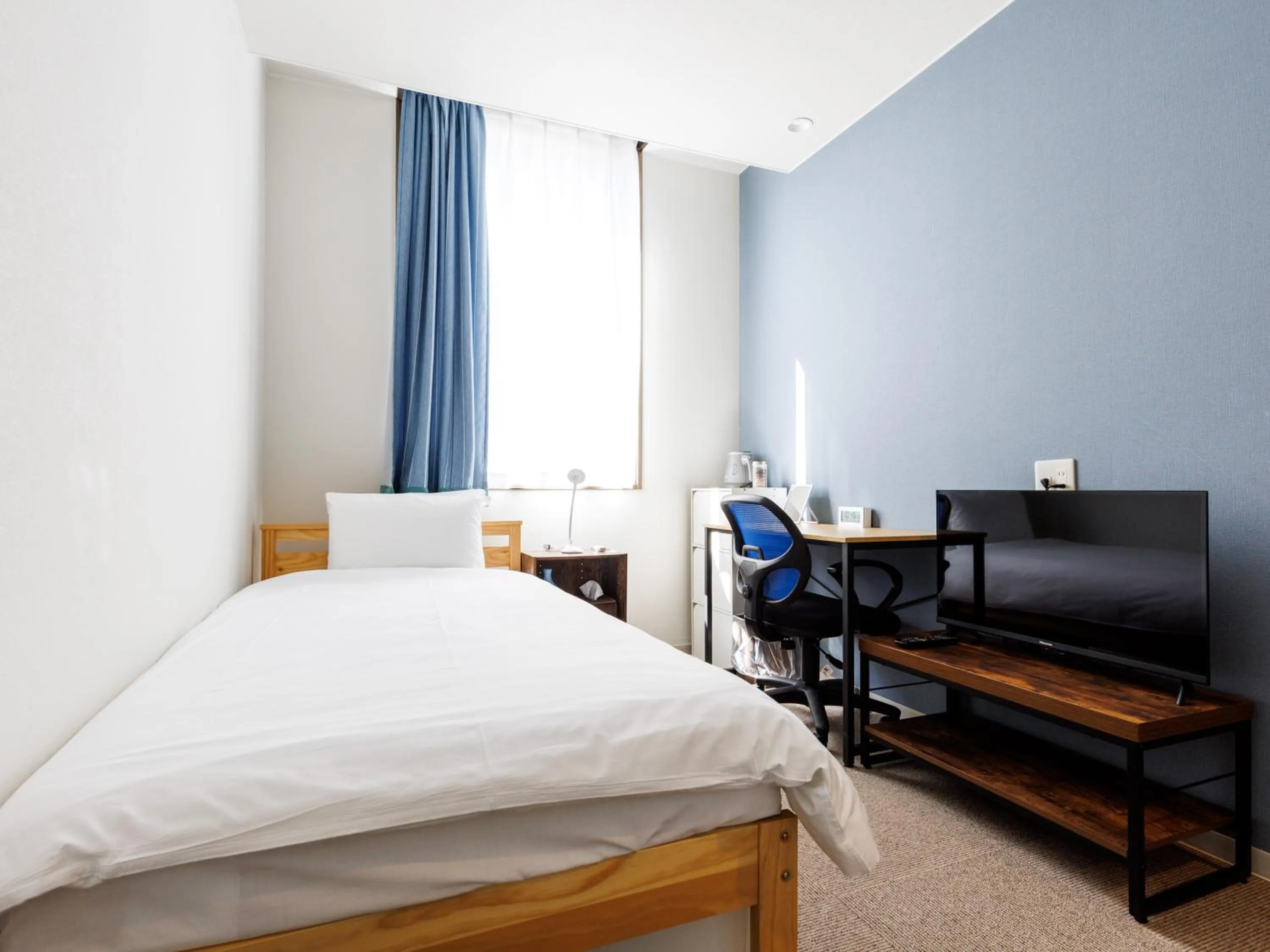 Bed in Tabist Kitami Athlete Stays