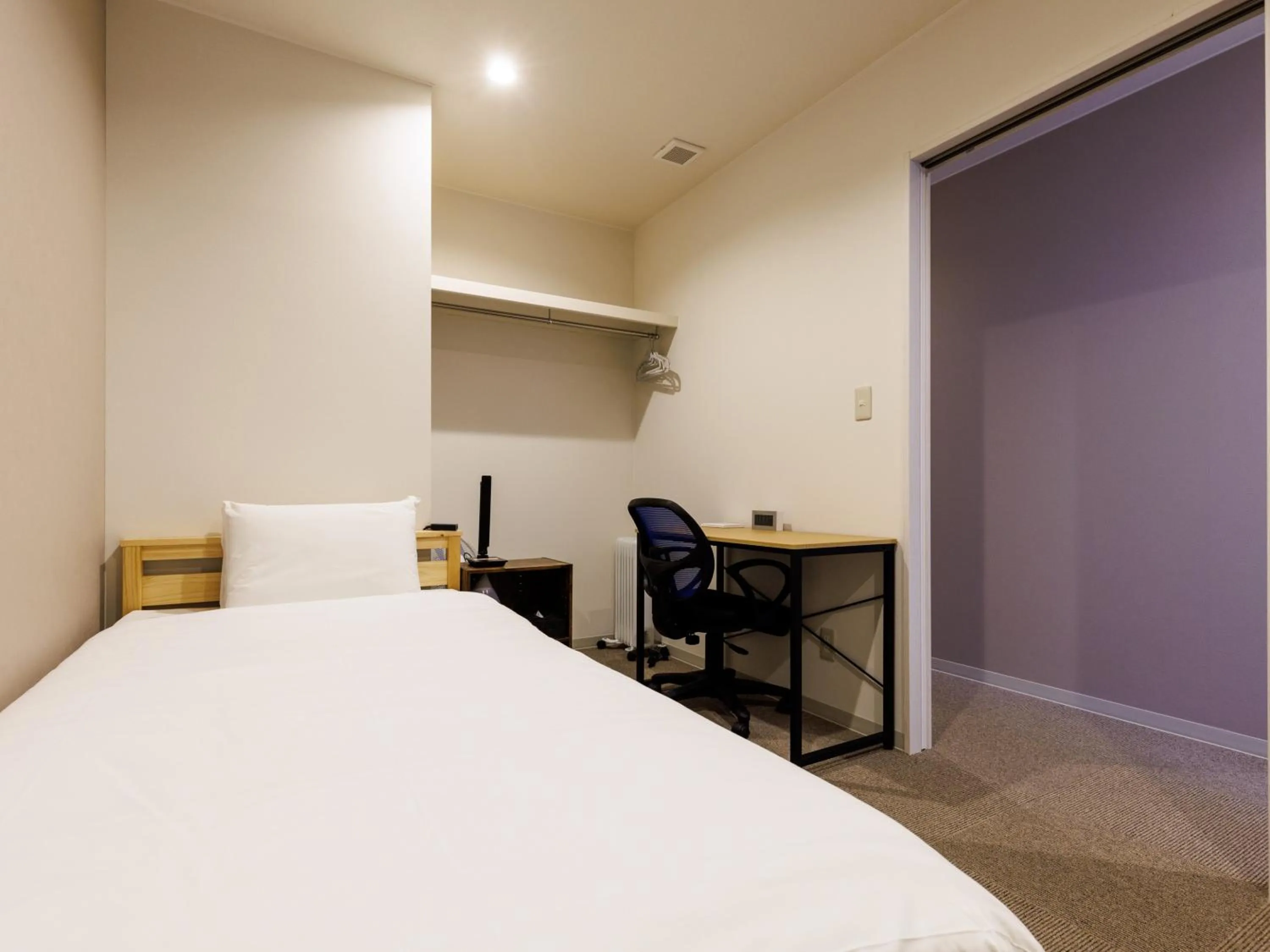 Bed in Tabist Kitami Athlete Stays