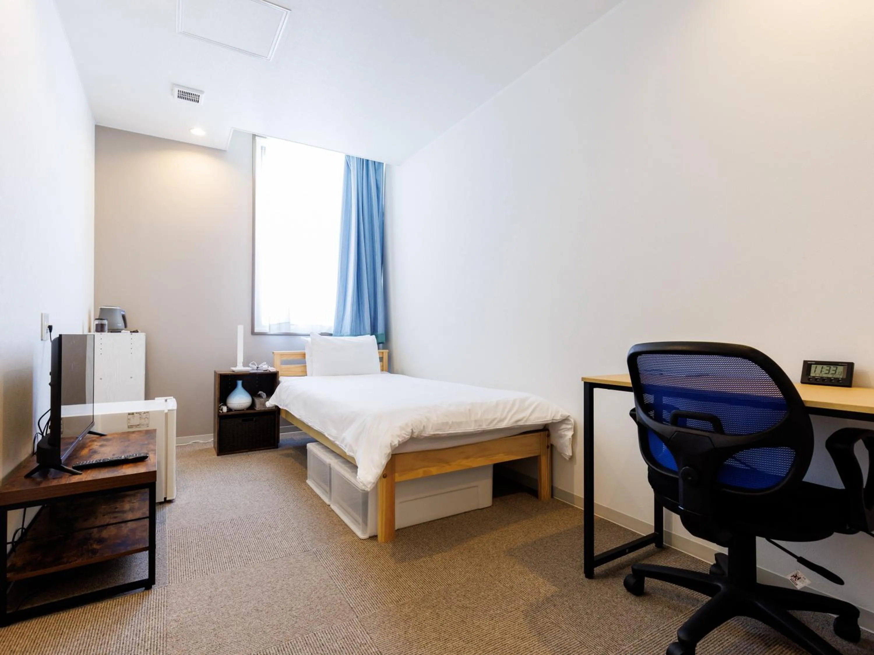 Bed in Tabist Kitami Athlete Stays