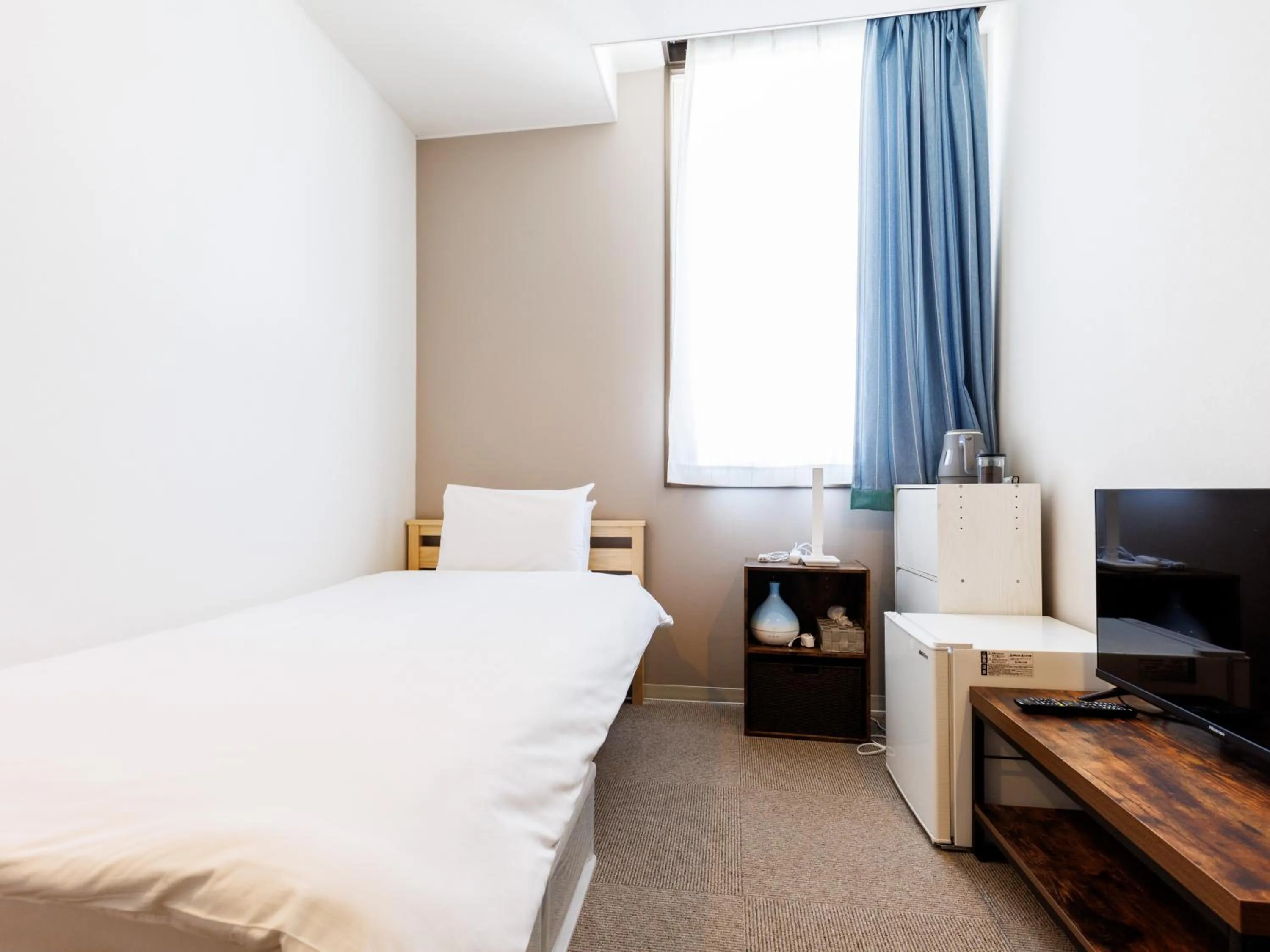 Bed in Tabist Kitami Athlete Stays