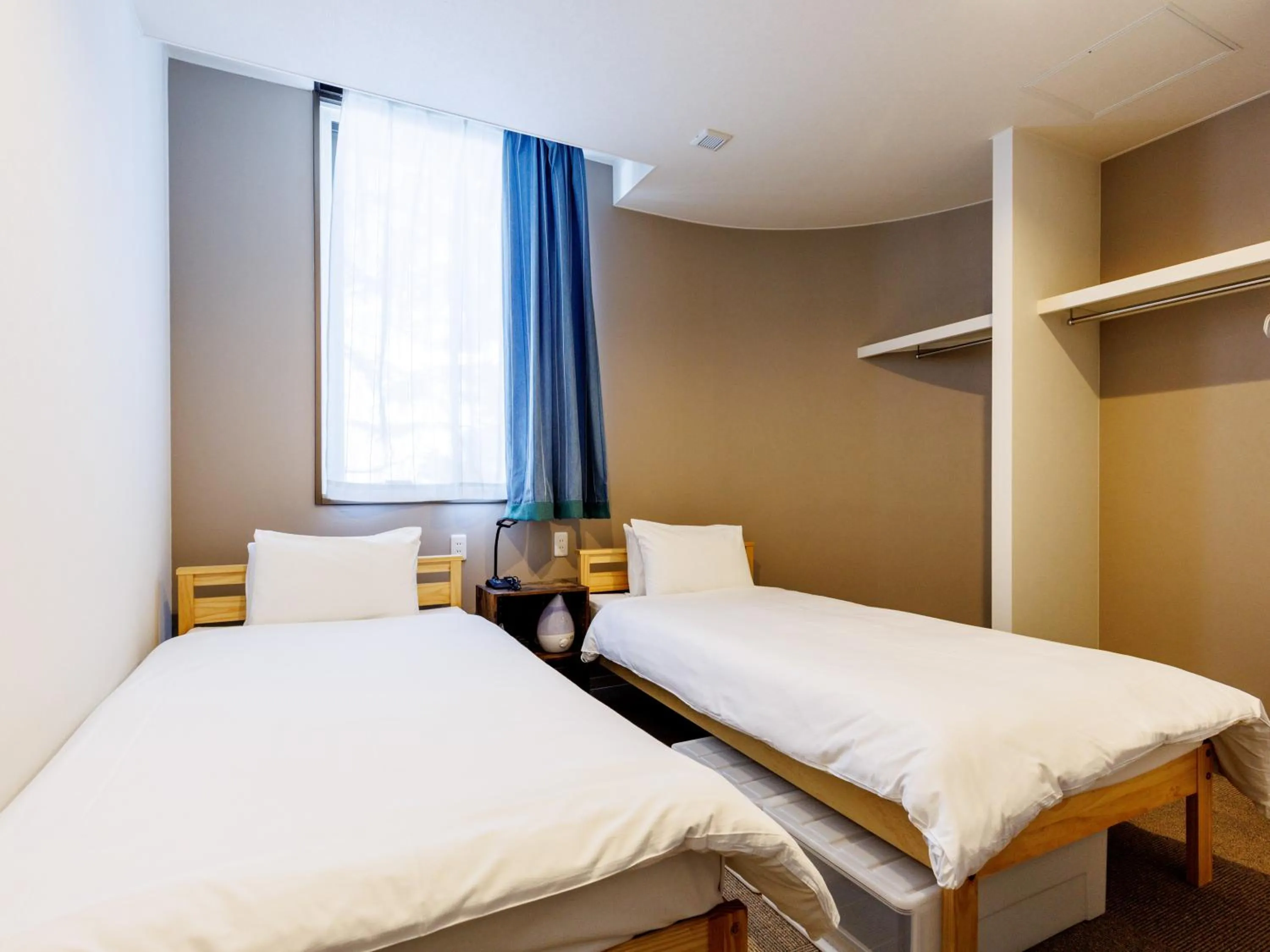 Bed in Tabist Kitami Athlete Stays