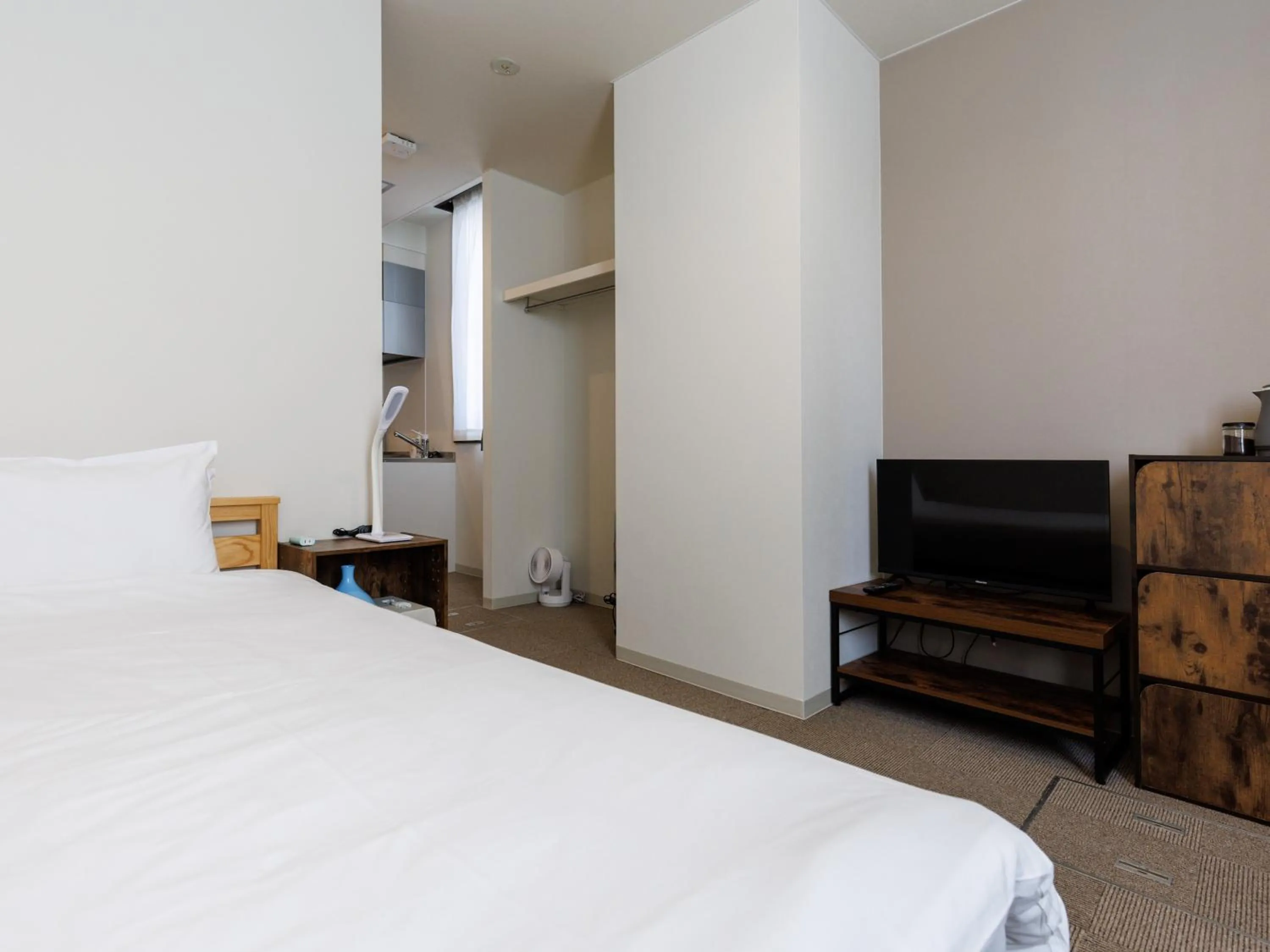 Bed in Tabist Kitami Athlete Stays