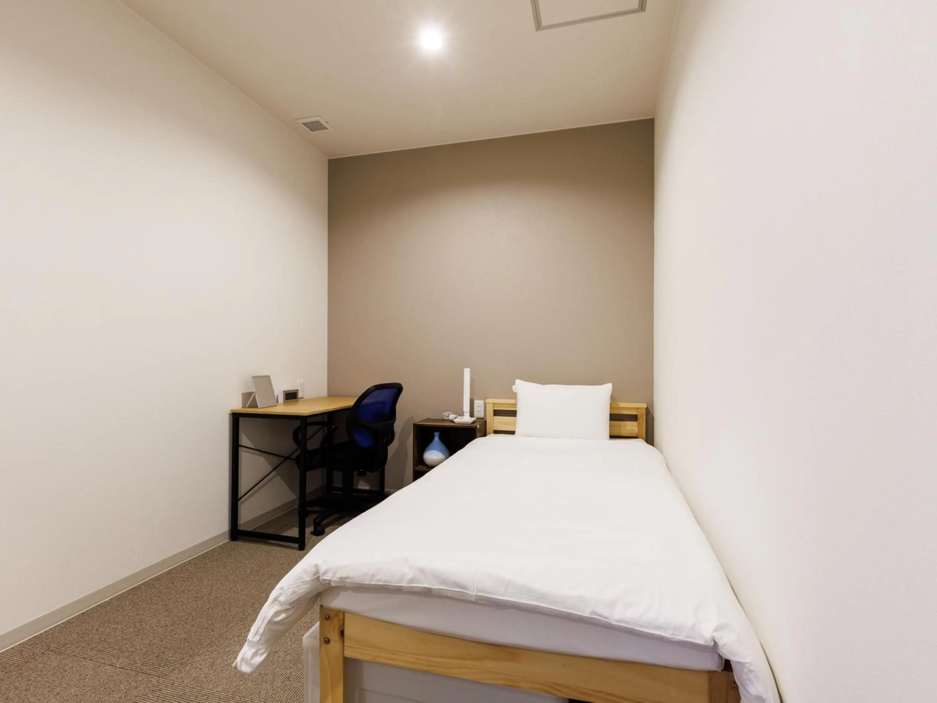 Bed in Tabist Kitami Athlete Stays