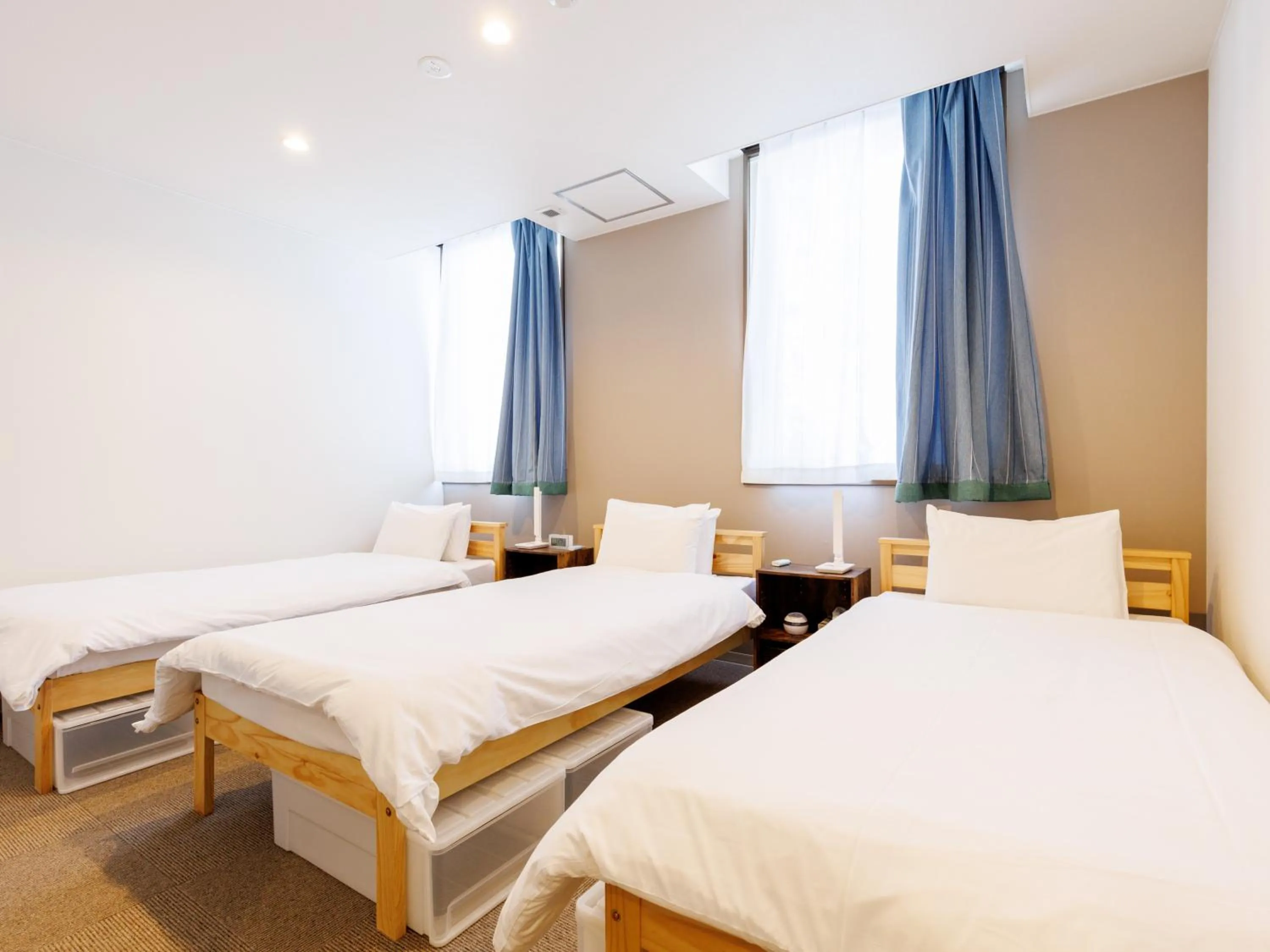 Bed in Tabist Kitami Athlete Stays