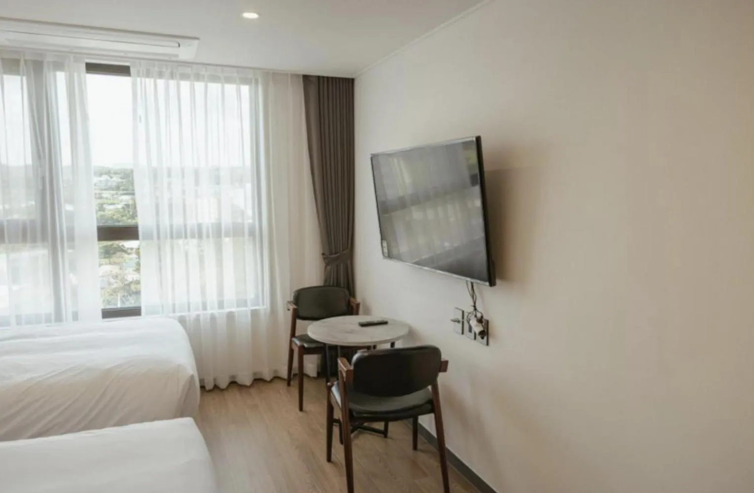 Bed in Lemain Hotel Seogwipo