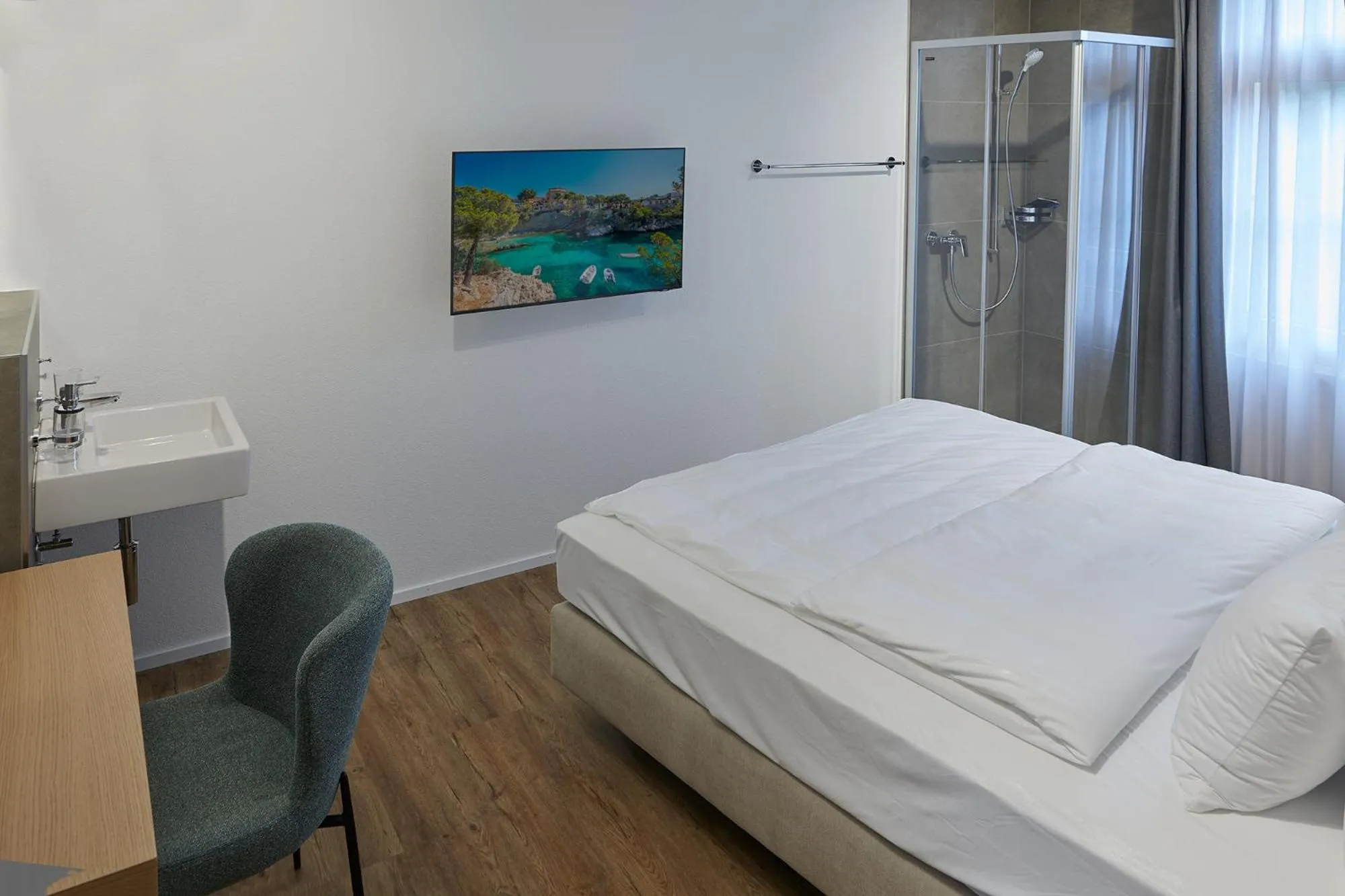 Bed in Hotel Jäger Jeuss - Murten - Self-Check-in