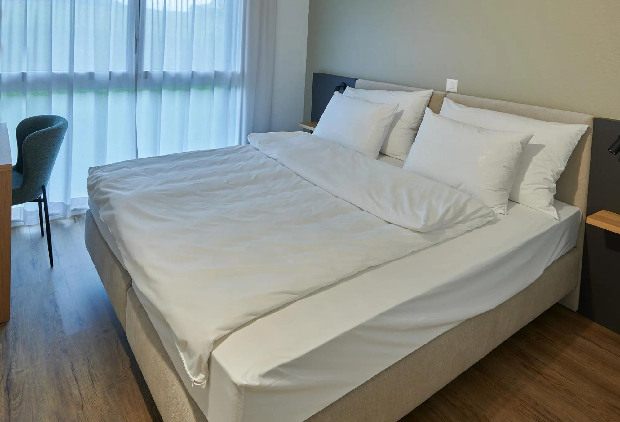 Bed in Hotel Jäger Jeuss - Murten - Self-Check-in