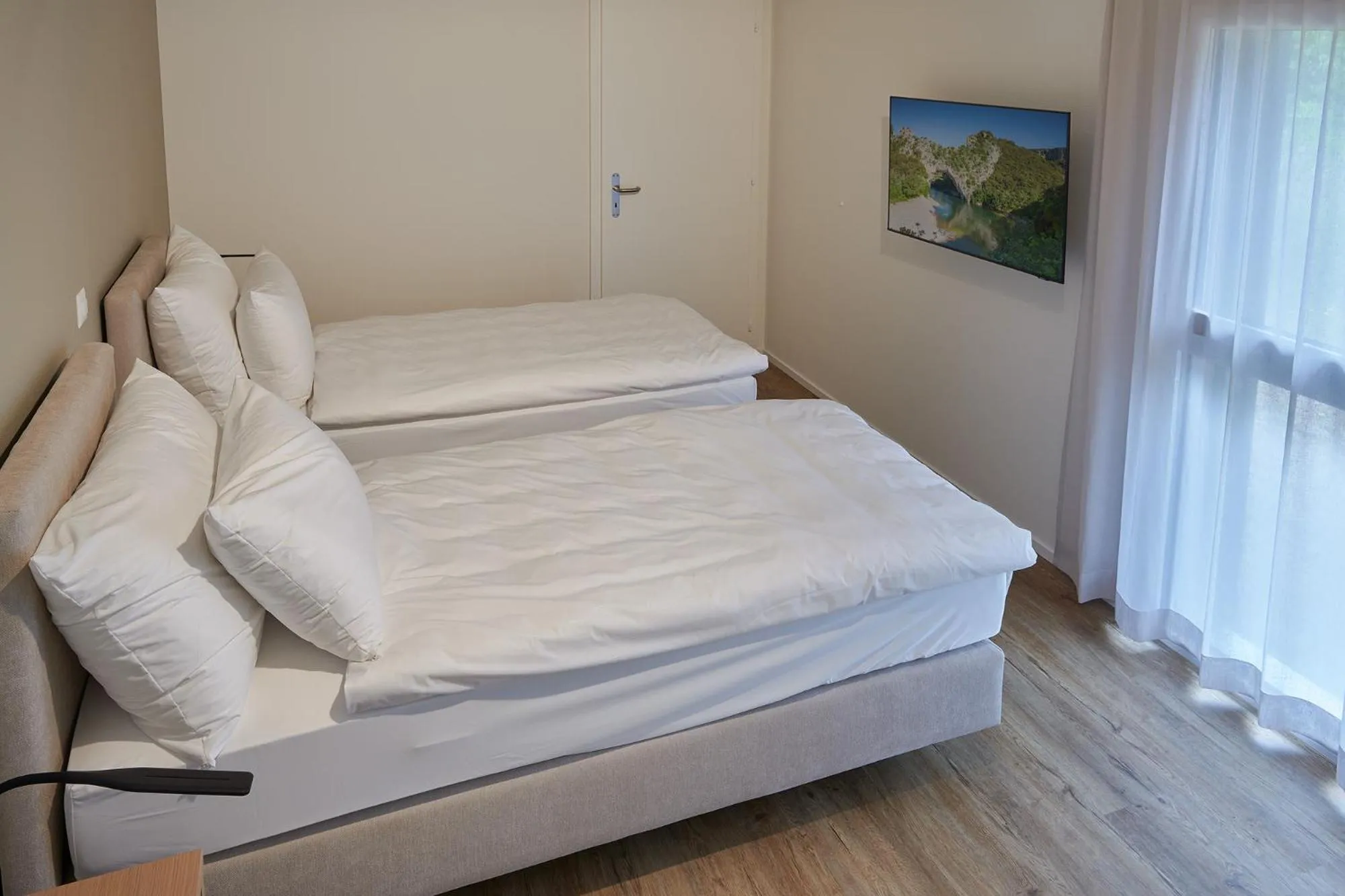 Bed in Hotel Jäger Jeuss - Murten - Self-Check-in