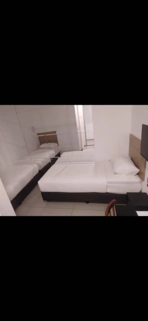 Bed in BIG TREE HOTEL