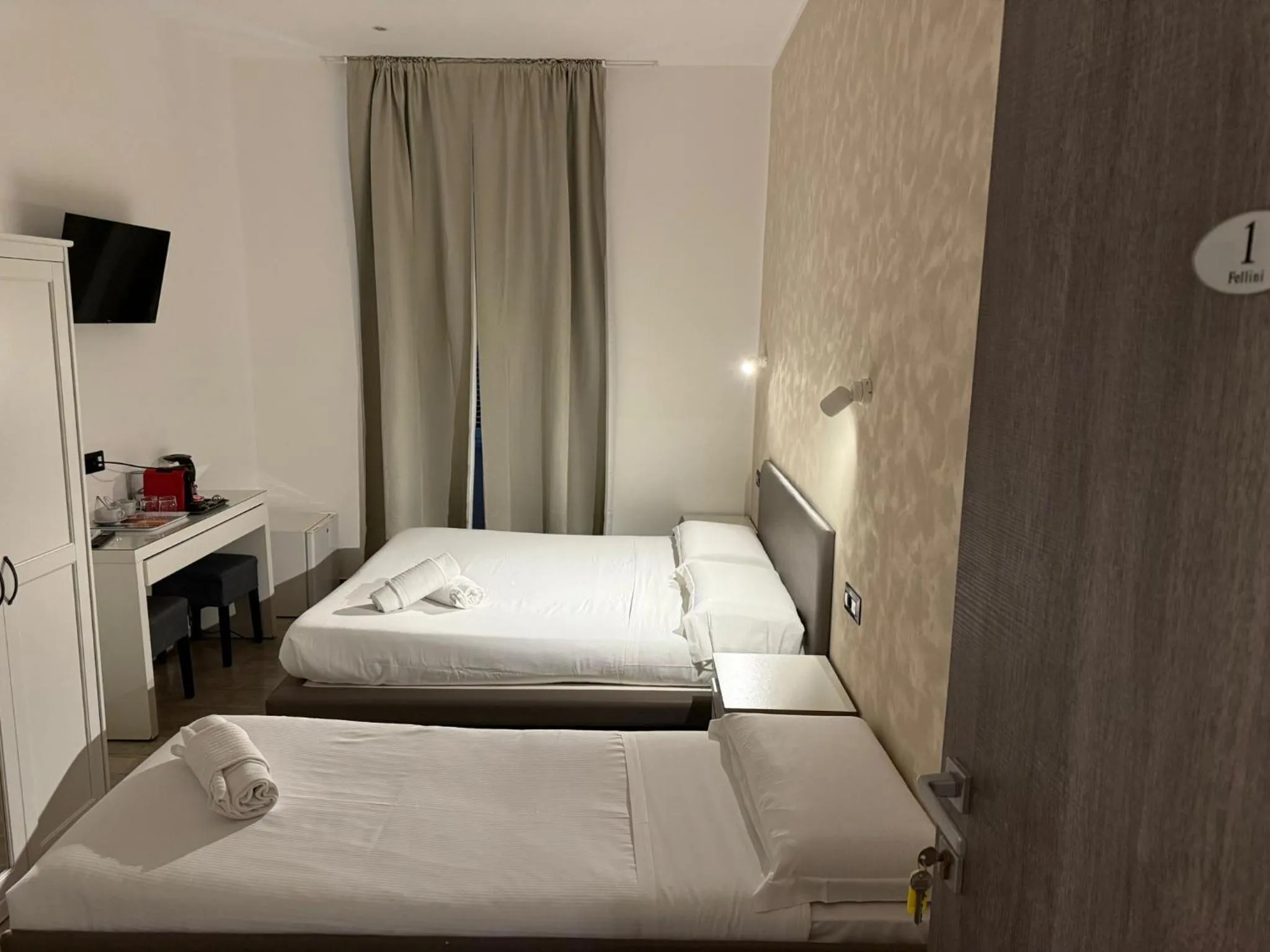 Bed in Relais Merulana Guest House
