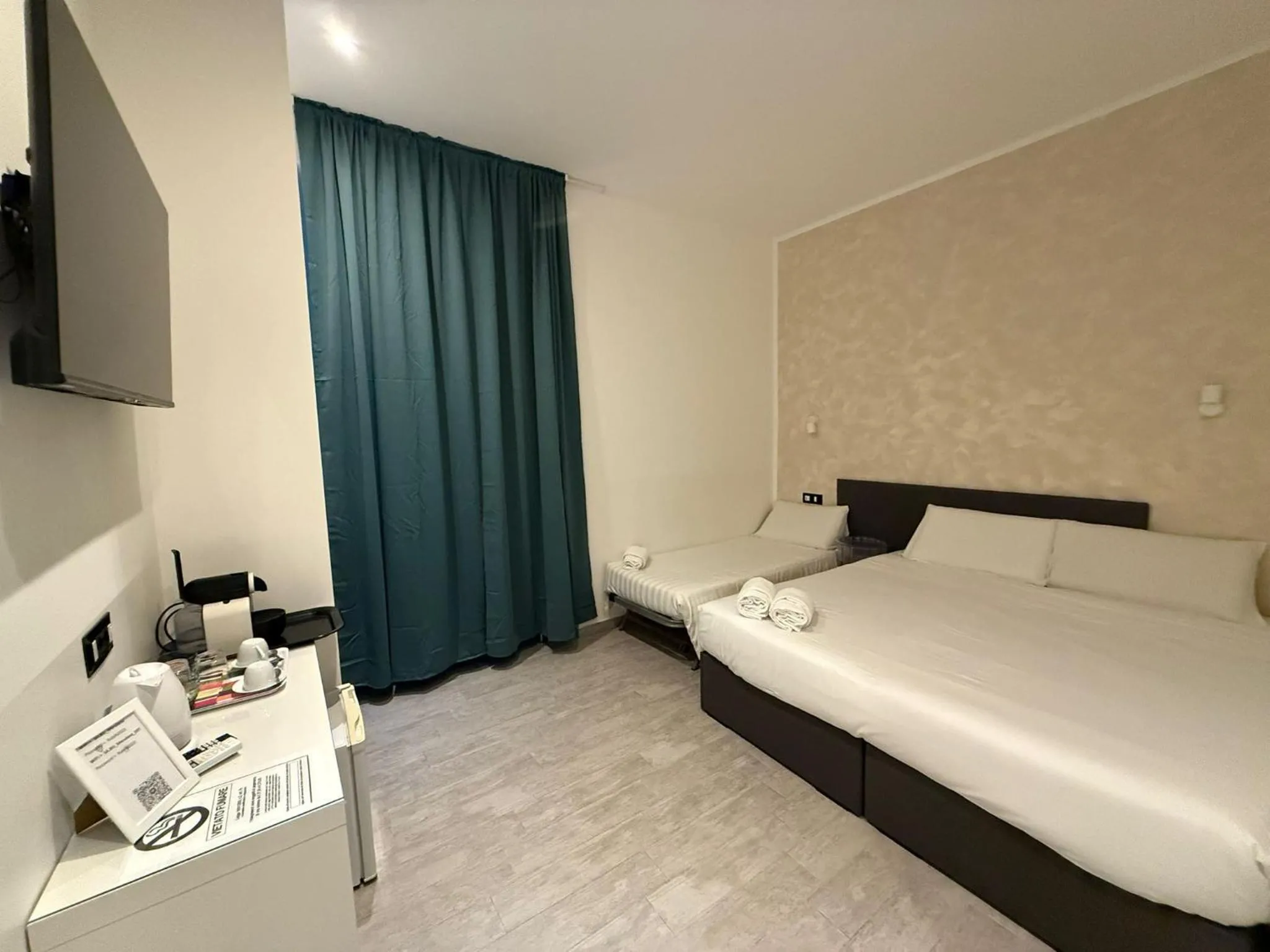 Bed in Relais Merulana Guest House