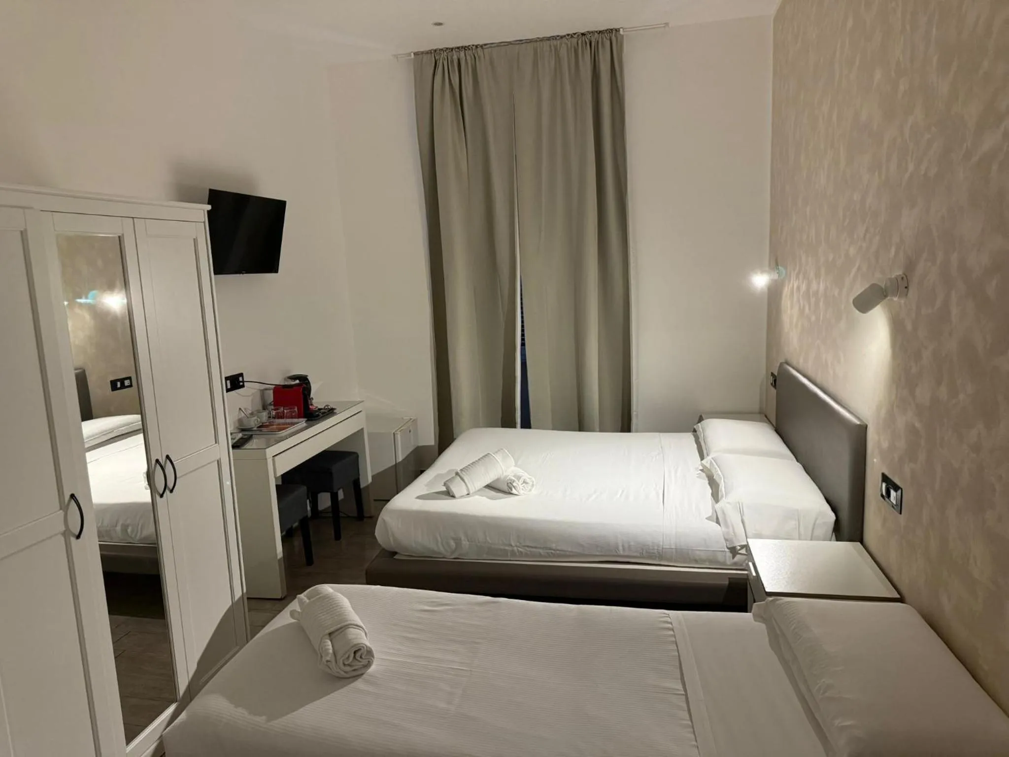 Bed in Relais Merulana Guest House