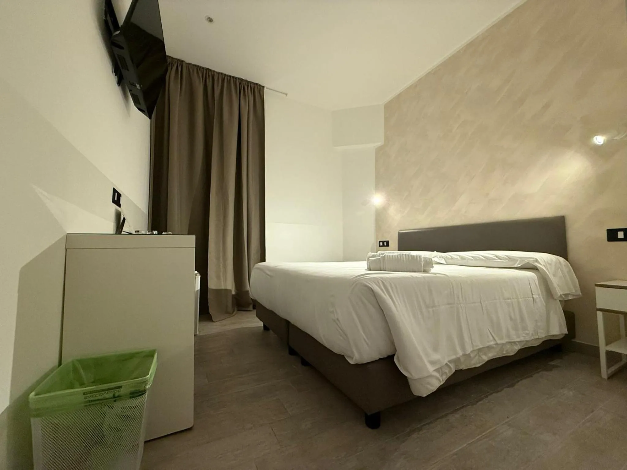 Bed in Relais Merulana Guest House