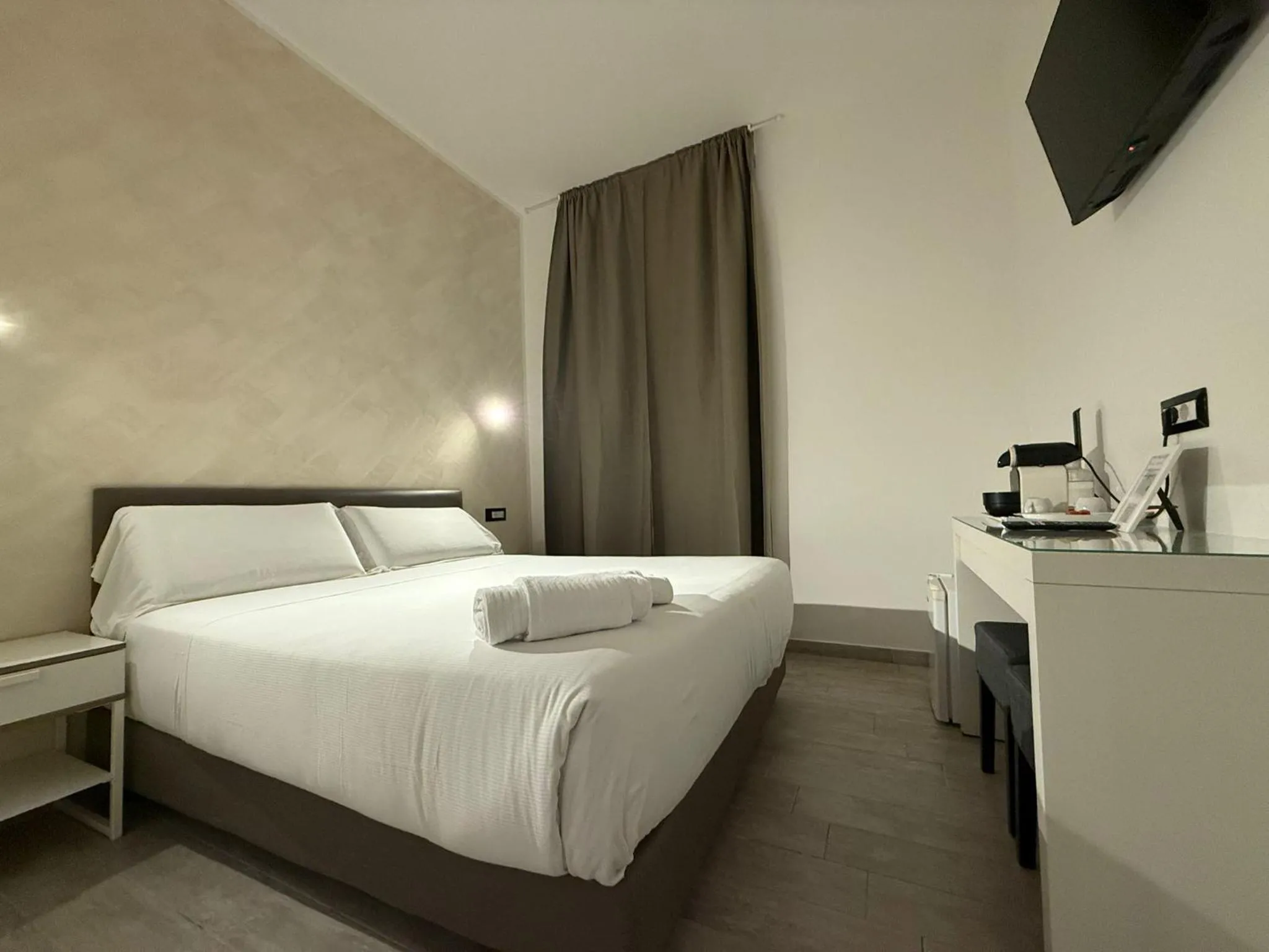 Bed in Relais Merulana Guest House