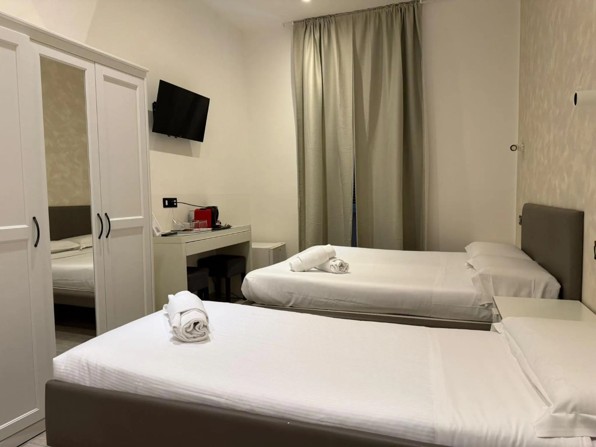 Bed in Relais Merulana Guest House