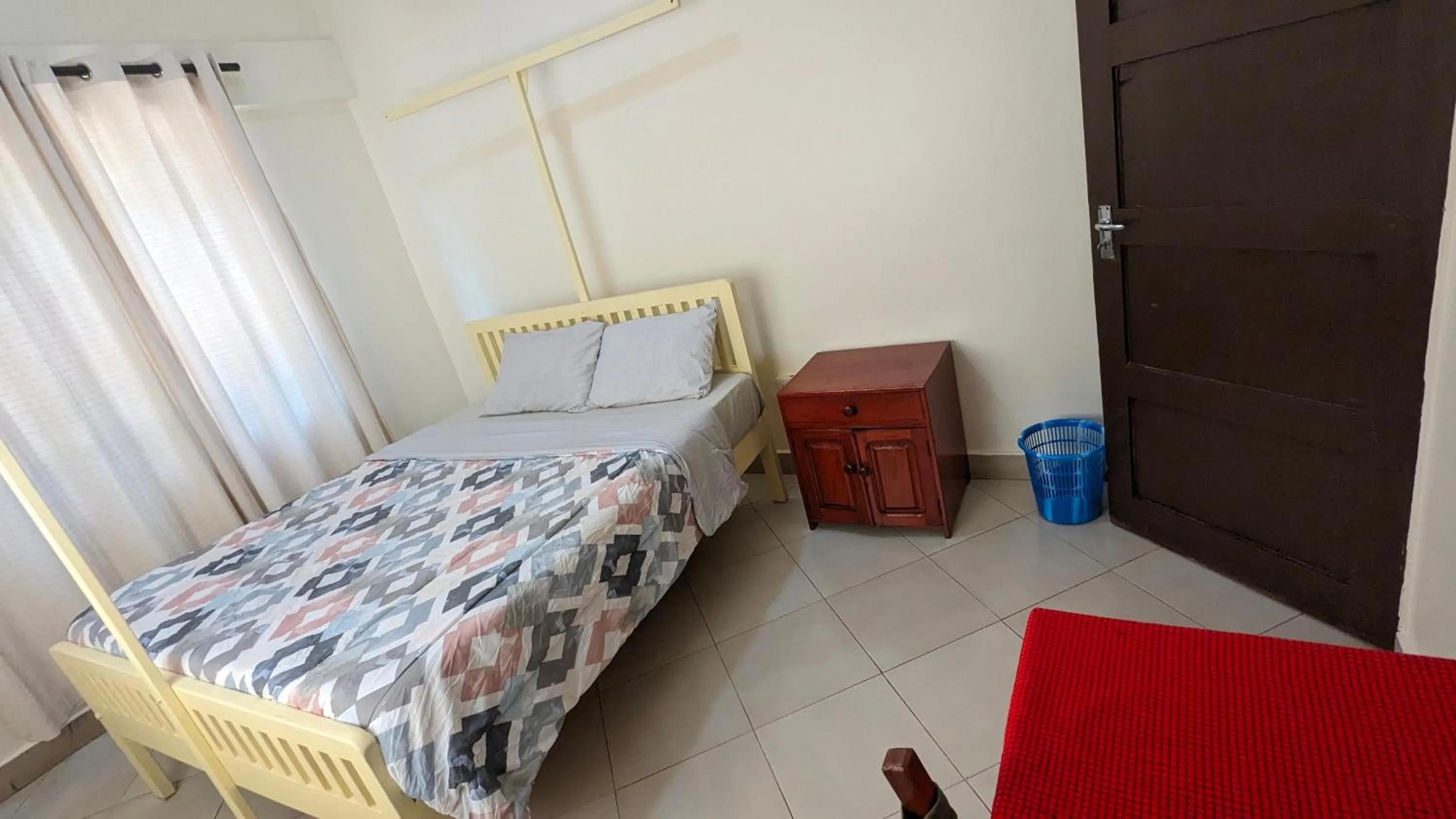 Bed in JACARANDA HOMESTAY