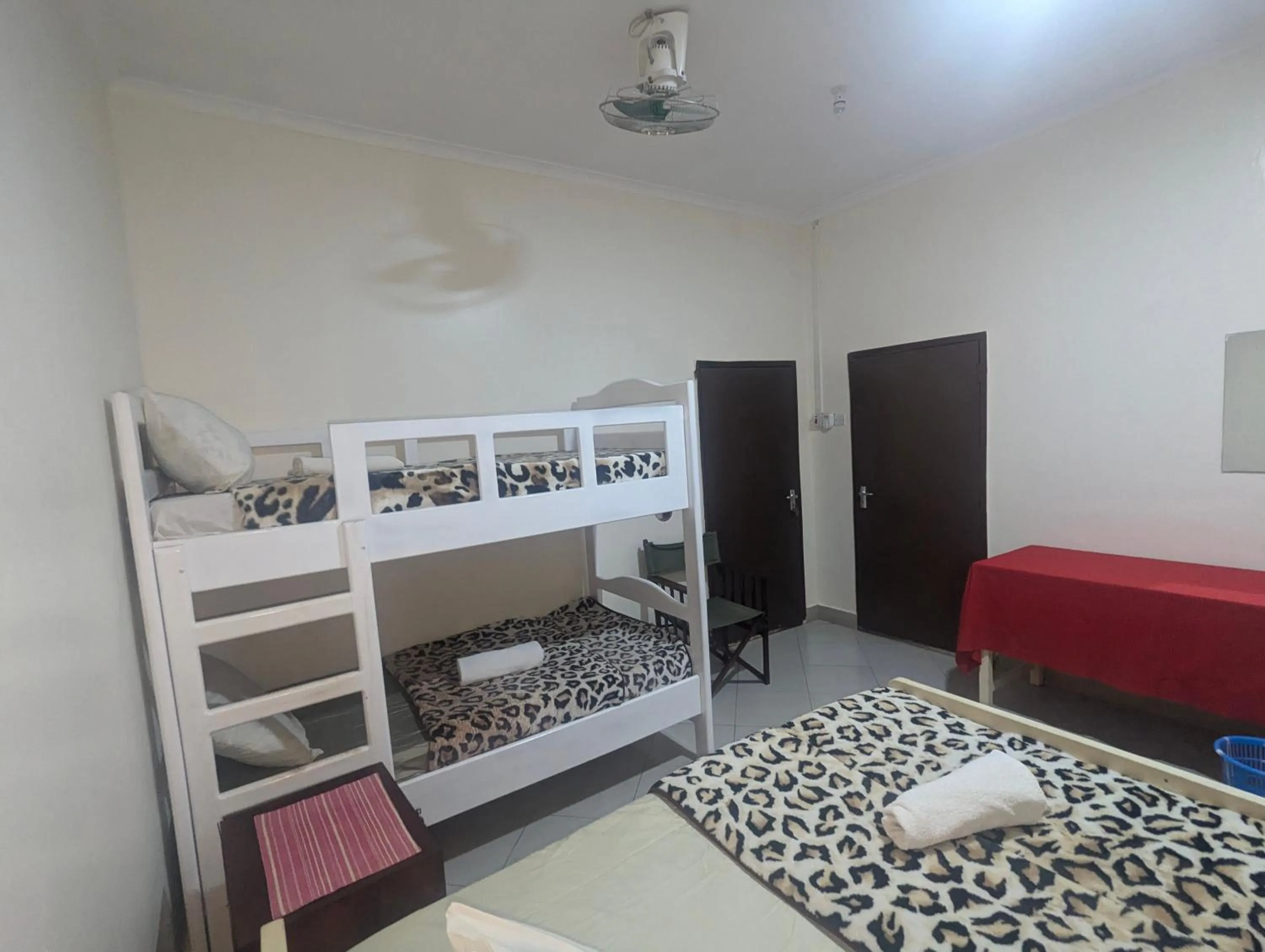 Bed in JACARANDA HOMESTAY