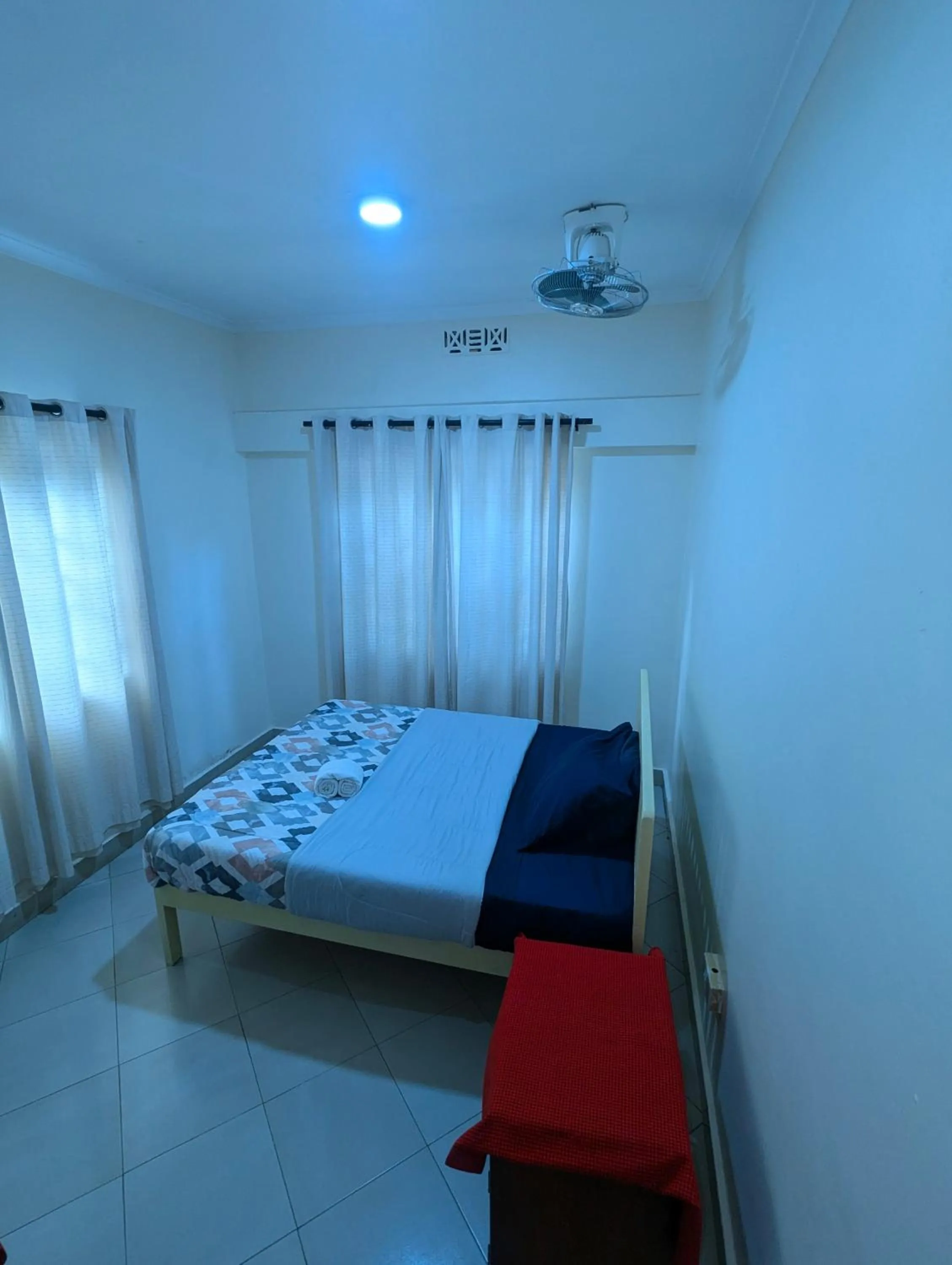 Bed in JACARANDA HOMESTAY