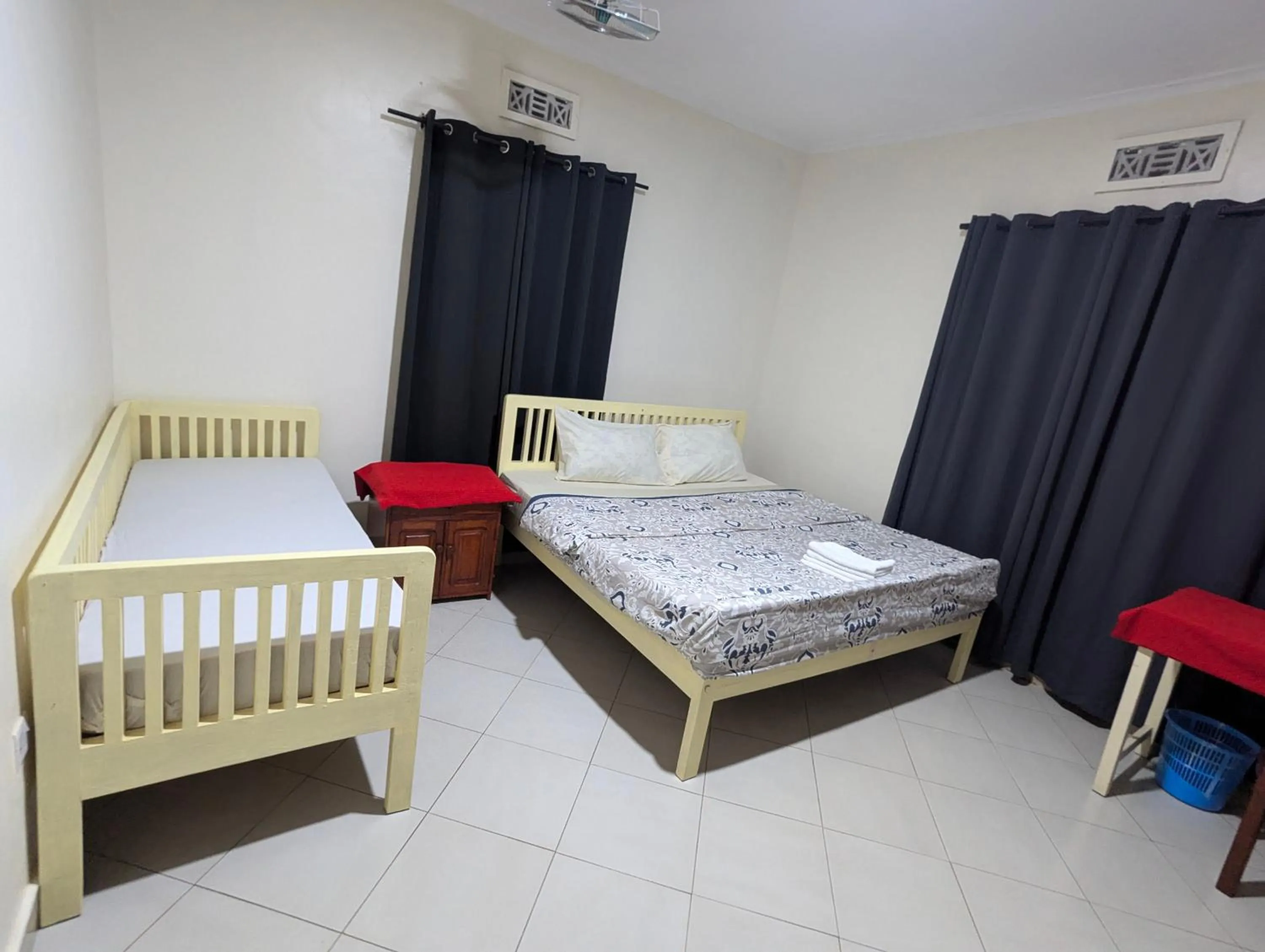 Bed in JACARANDA HOMESTAY