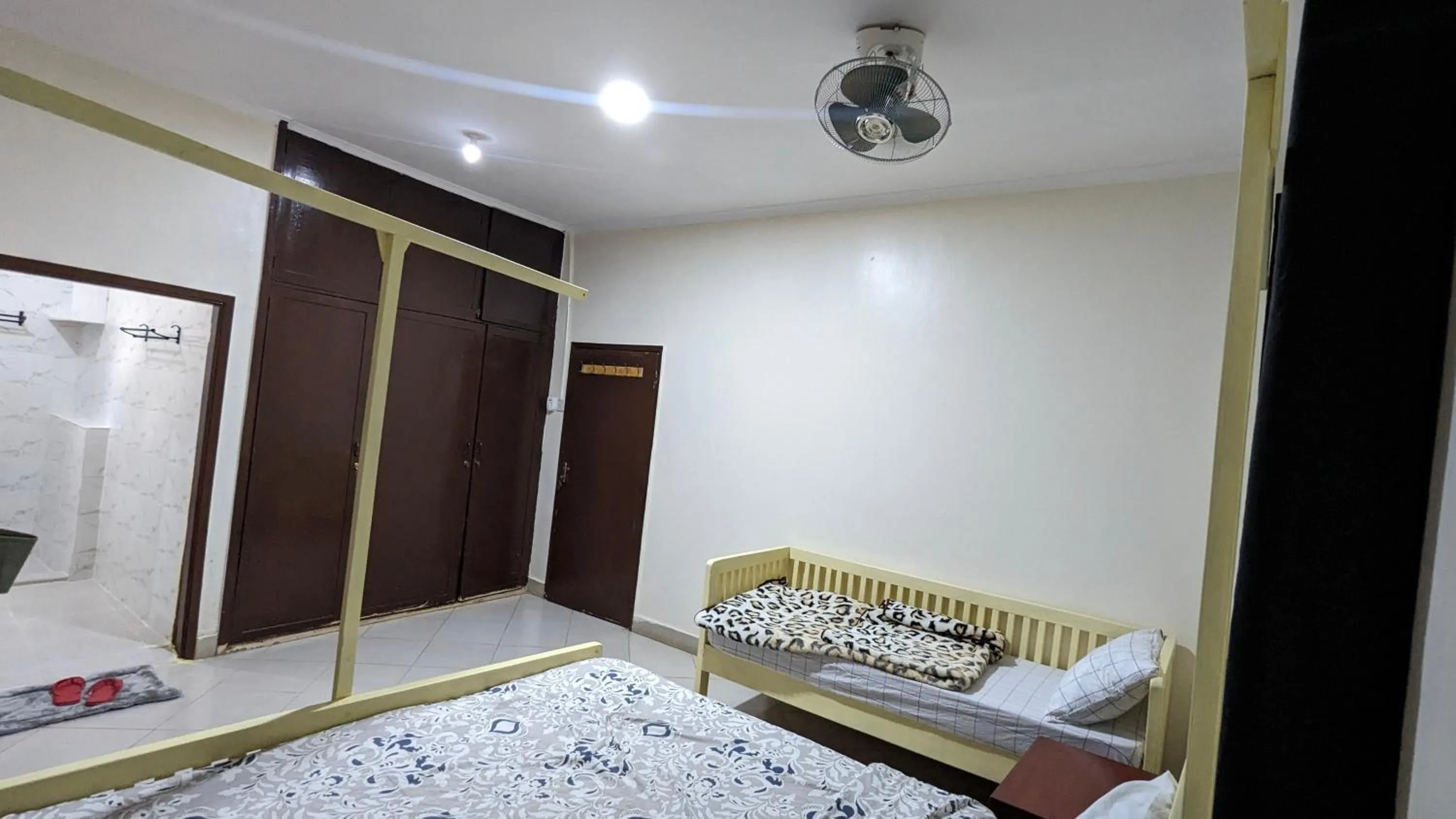 Bed in JACARANDA HOMESTAY