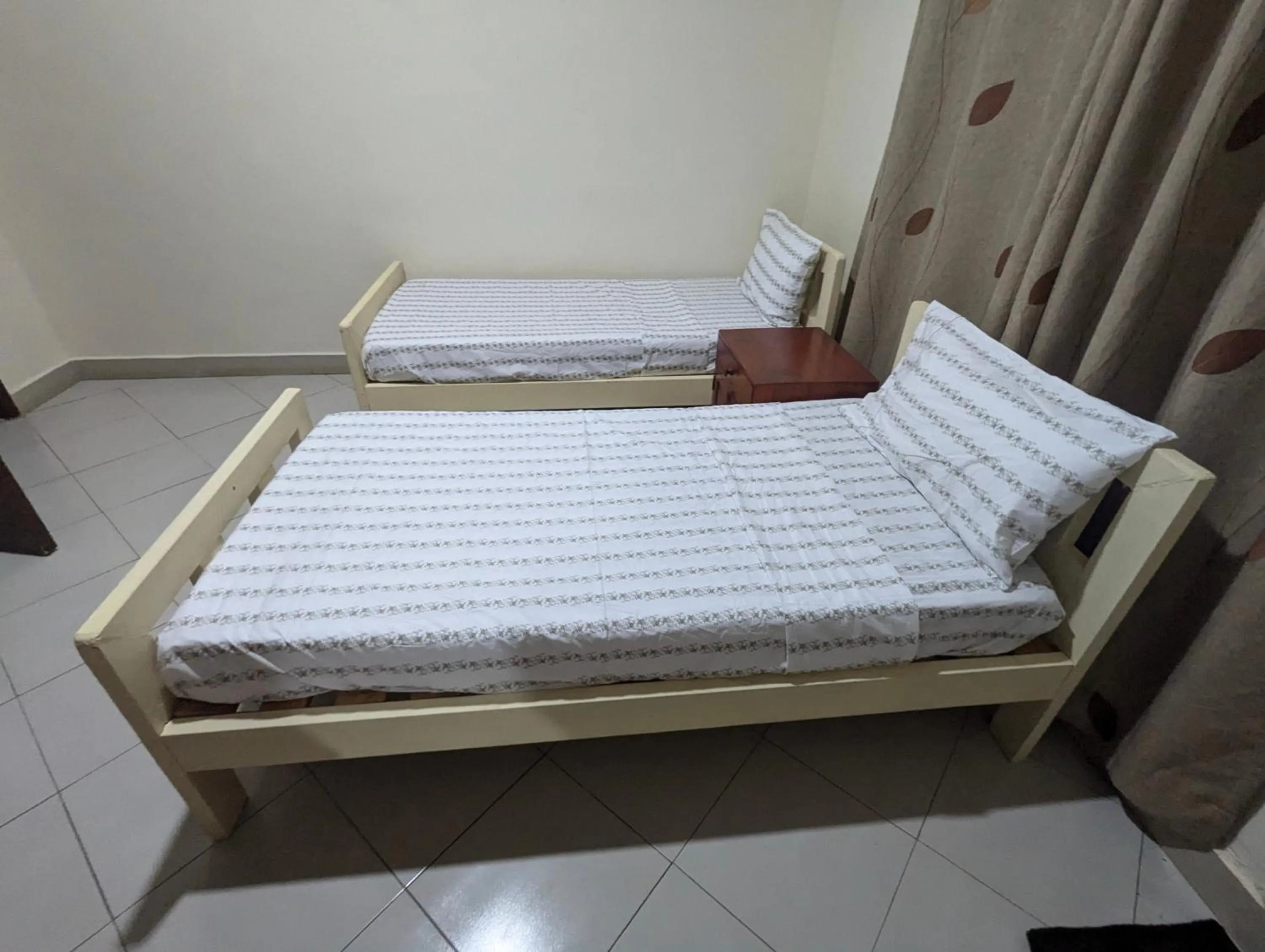 Bed in JACARANDA HOMESTAY