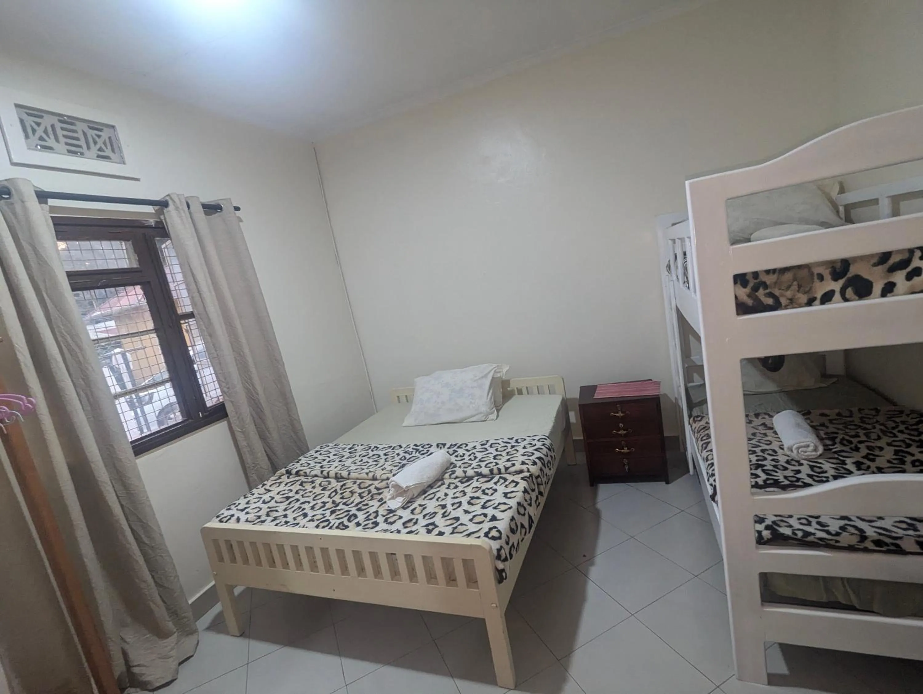 Bed in JACARANDA HOMESTAY