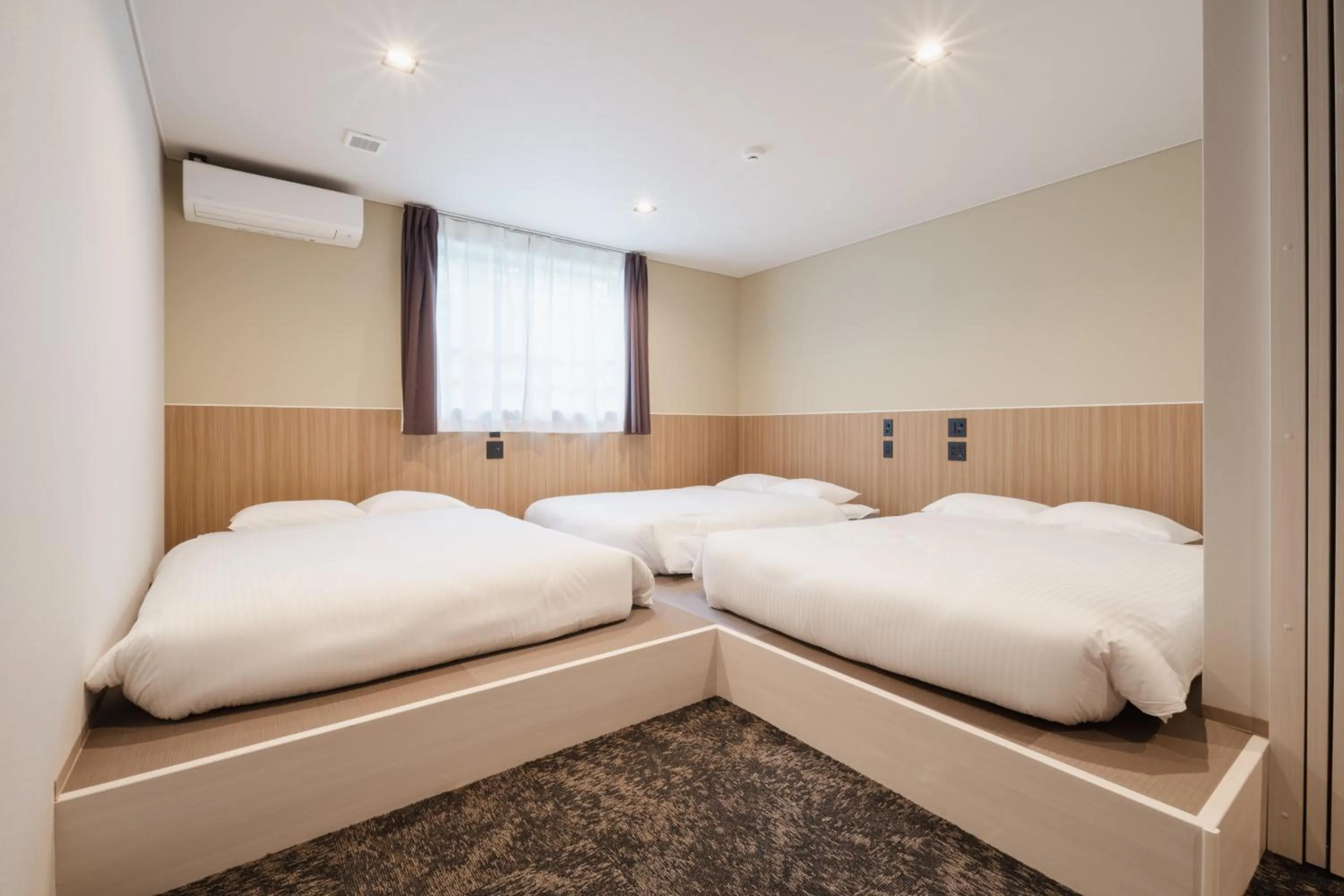 Bed in Hotel Ninestates Kagoshima