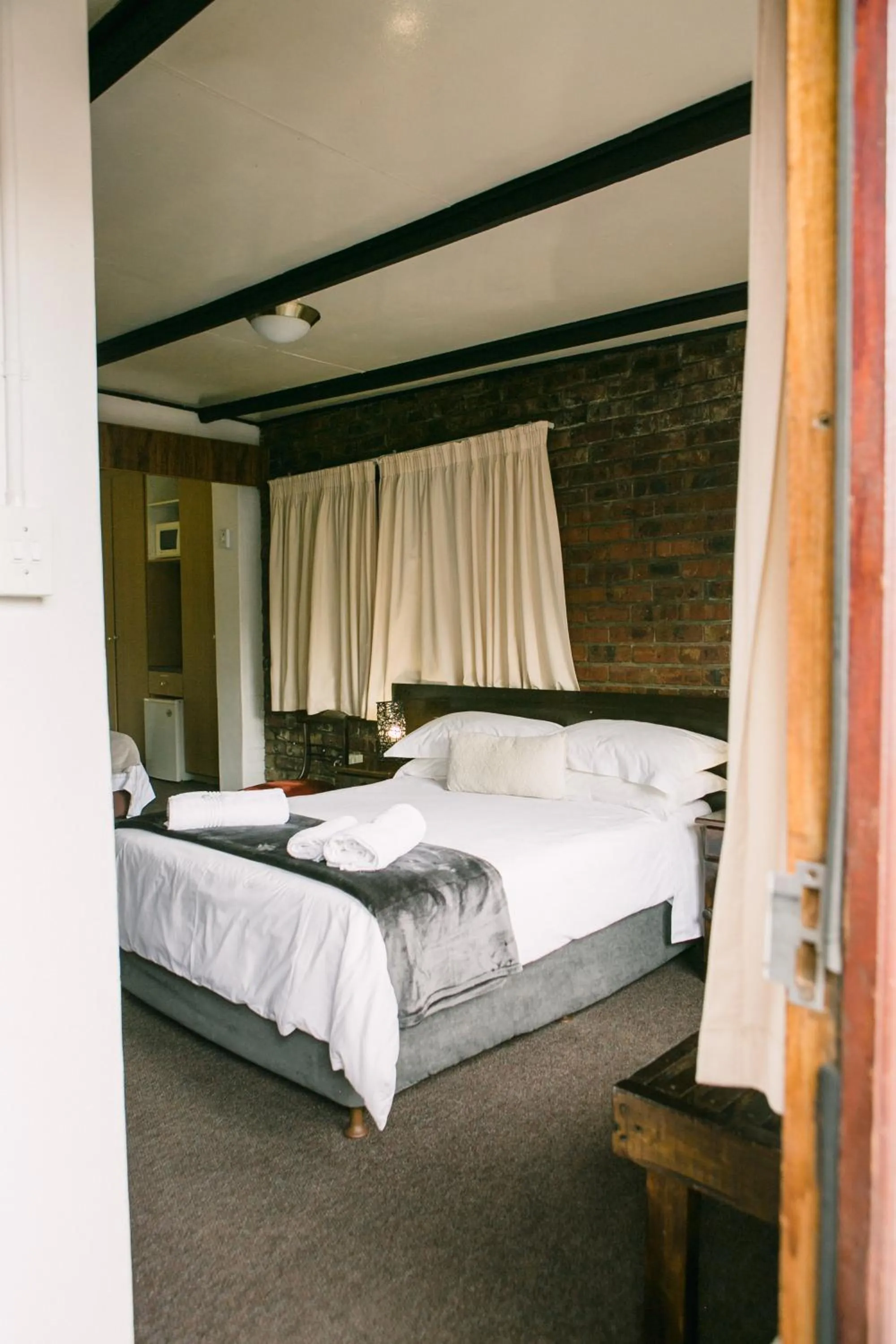 Bed in Pennylane Guest House